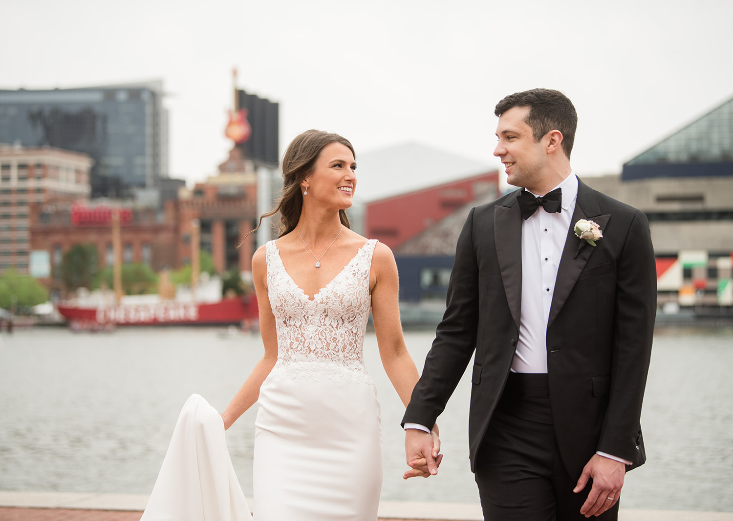 bride and groom wedding day portraits in front of a lake