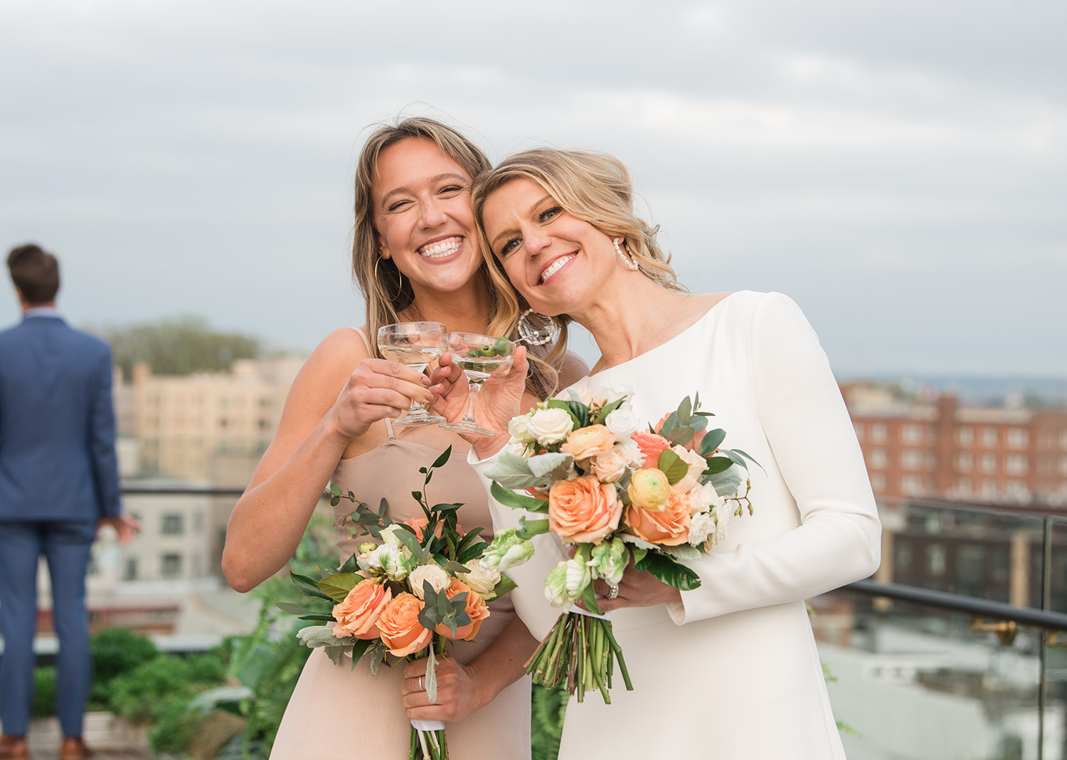 bride posing with her family on her wedding day on the rooftop of the Line hotel in Washington