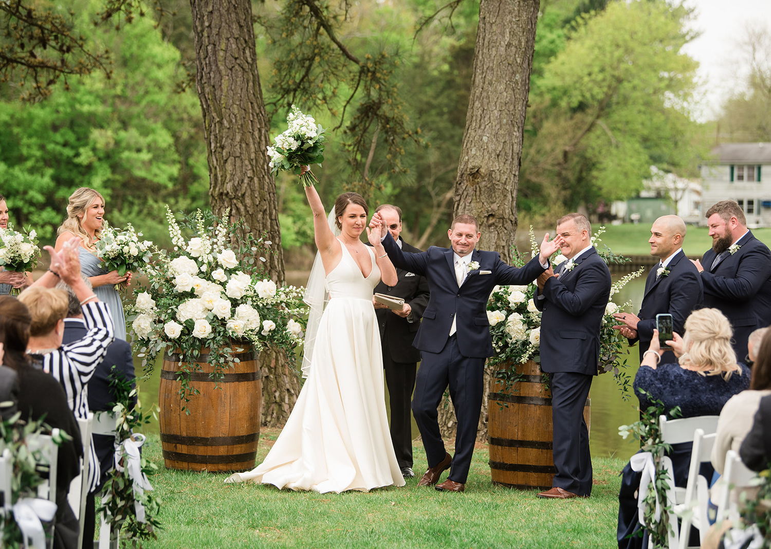 bride and groom celebrate as they are finally announced husband and wife