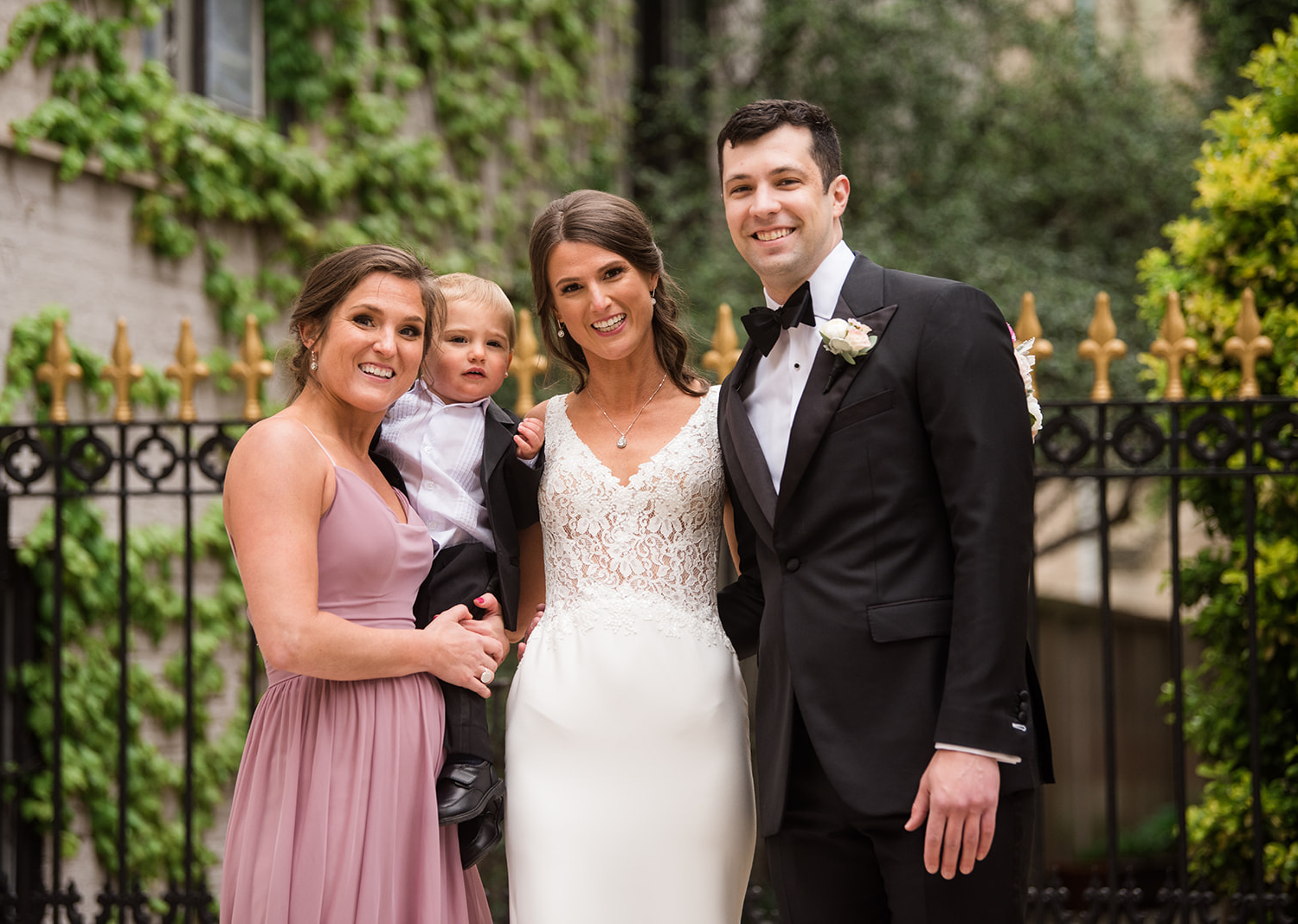 bride and groom stand with their wedding party