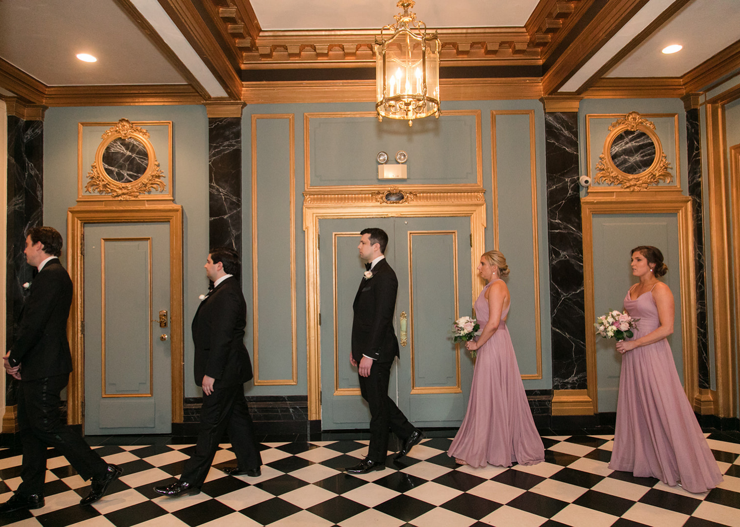 wedding party wait to make their entrance for the wedding at the Belvedere Hotel