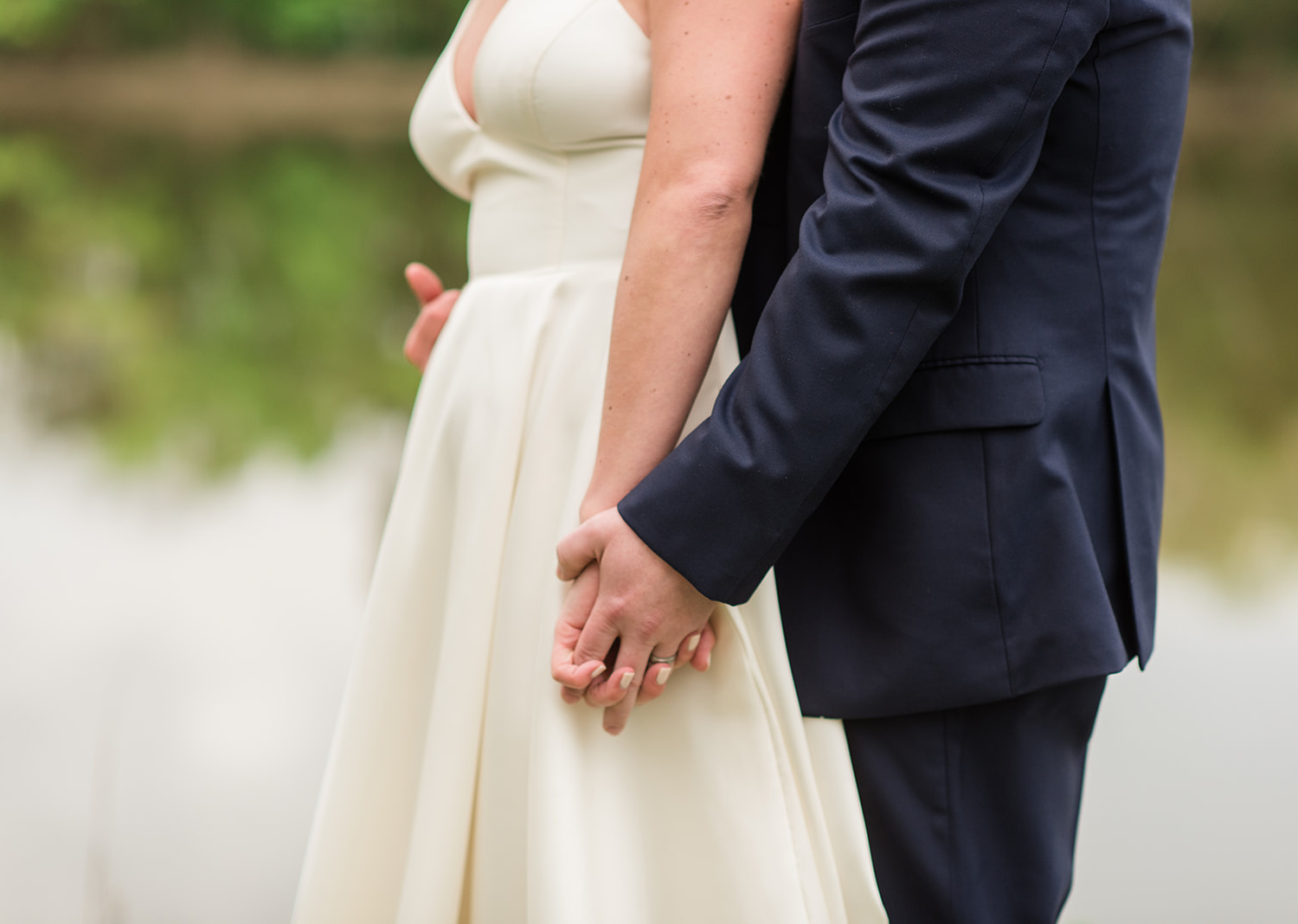 bride and groom holding hands