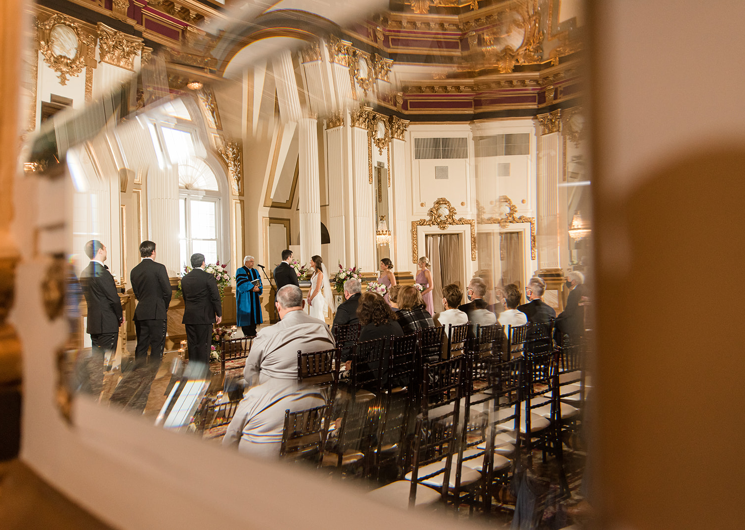 bride and groom during their wedding ceremony at the Belvedere Hotel