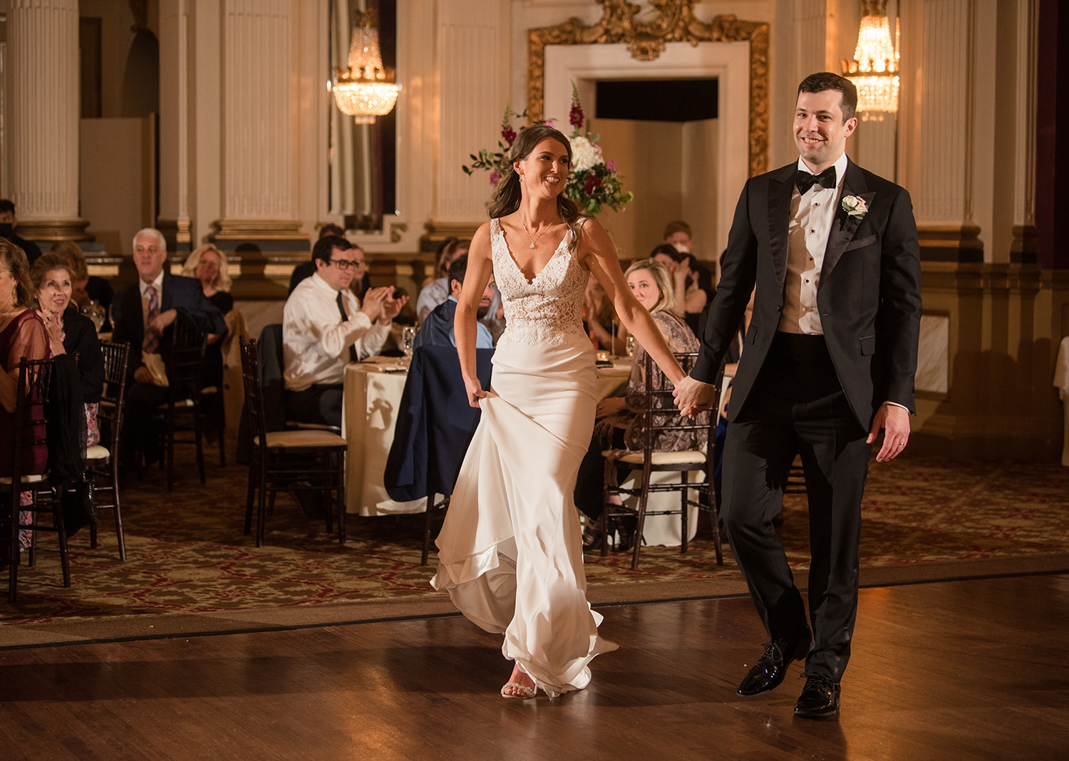 bride and groom make their grand entrance at their wedding reception