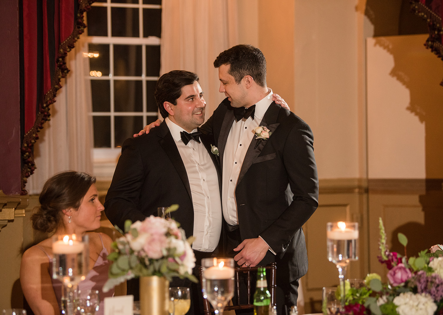 groom hugging his best man