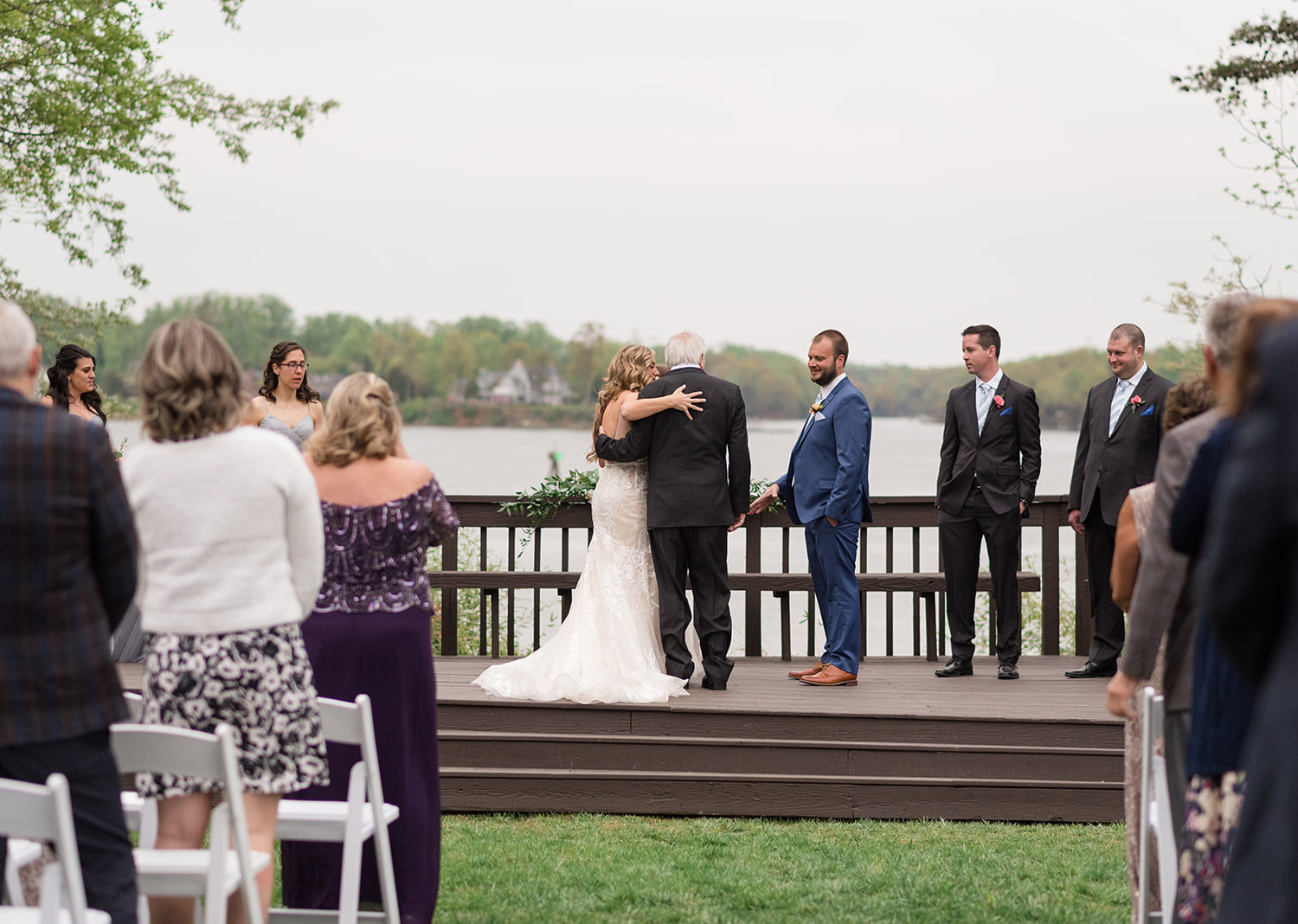 father giving bride away to the groom