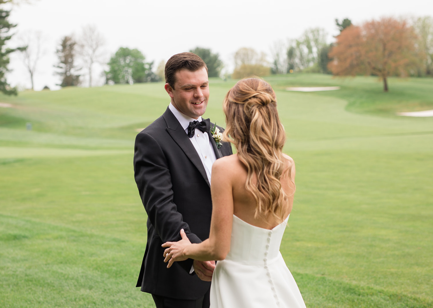 bride and groom romantically looking at eachother 