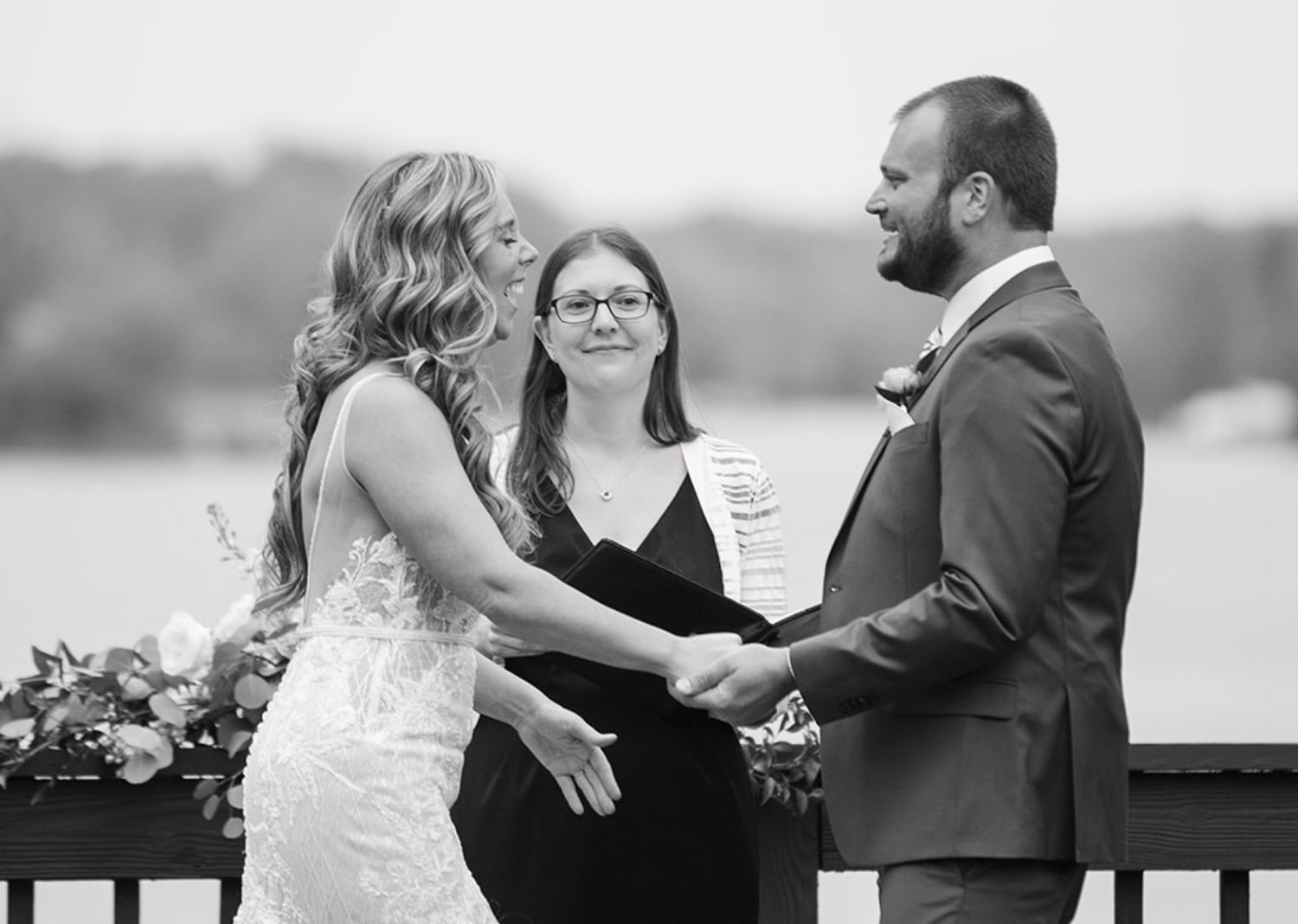 black and white photo of bride and groom during their wedding ceremony