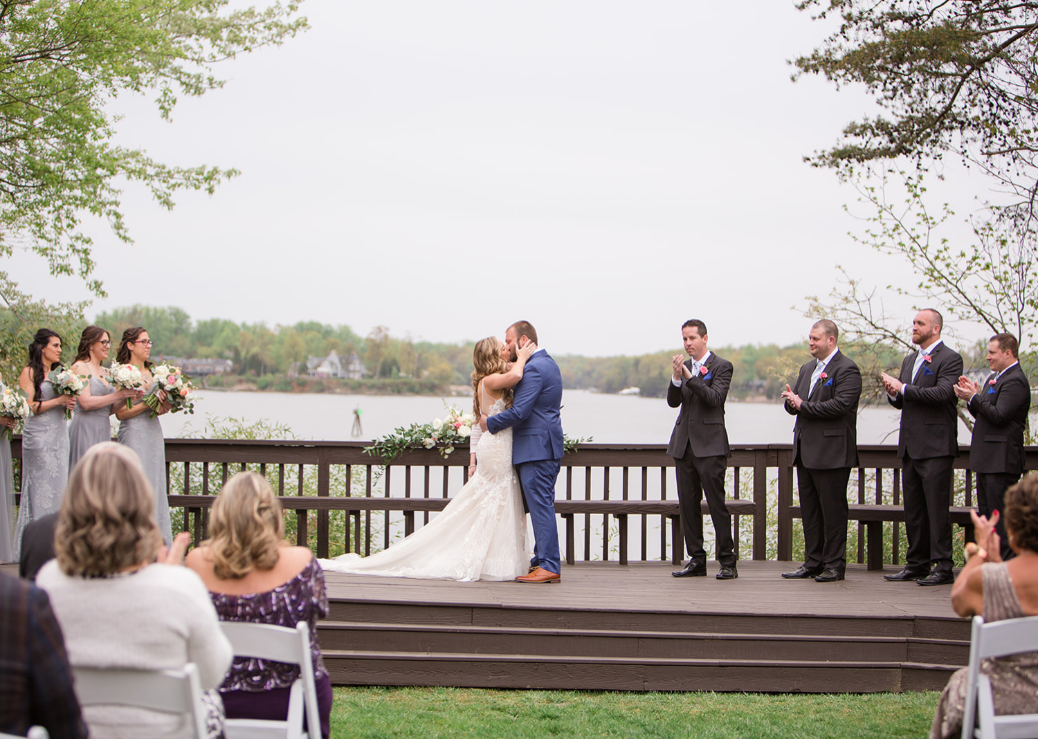 bride and groom share their first kiss as husband and wife