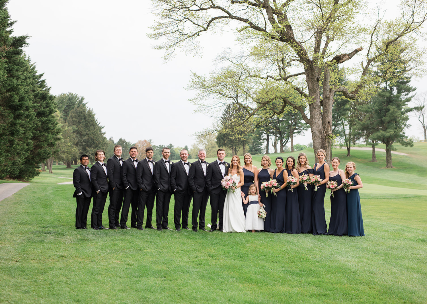 bride and groom with their bridal party 