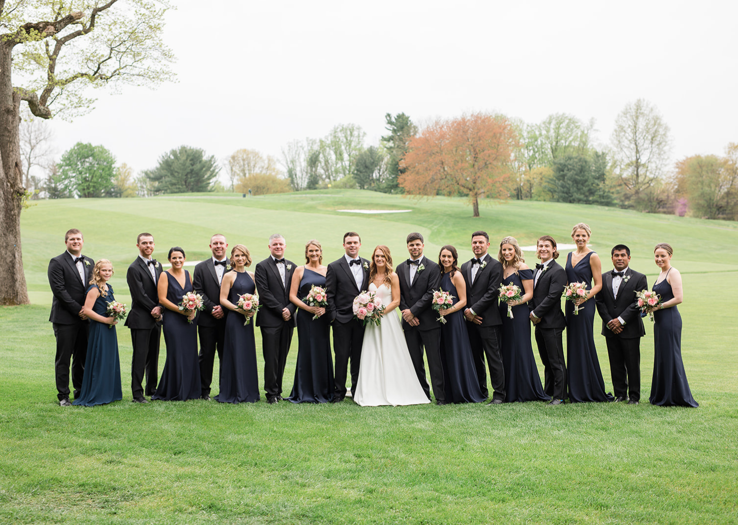 bride and groom with their bridal party 