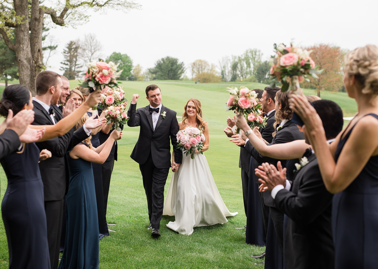 bride and groom with their bridal party 