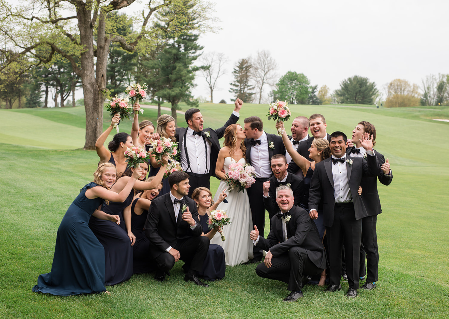 bride and groom with their bridal party 