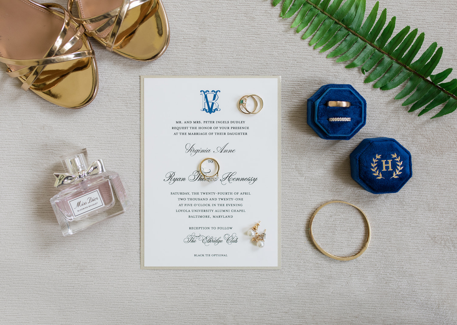 wedding day details and wedding rings on a flatlay 