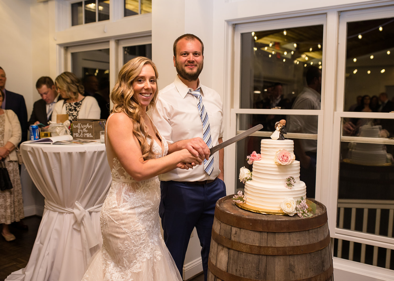 bride and groom cutting their wedding cake 