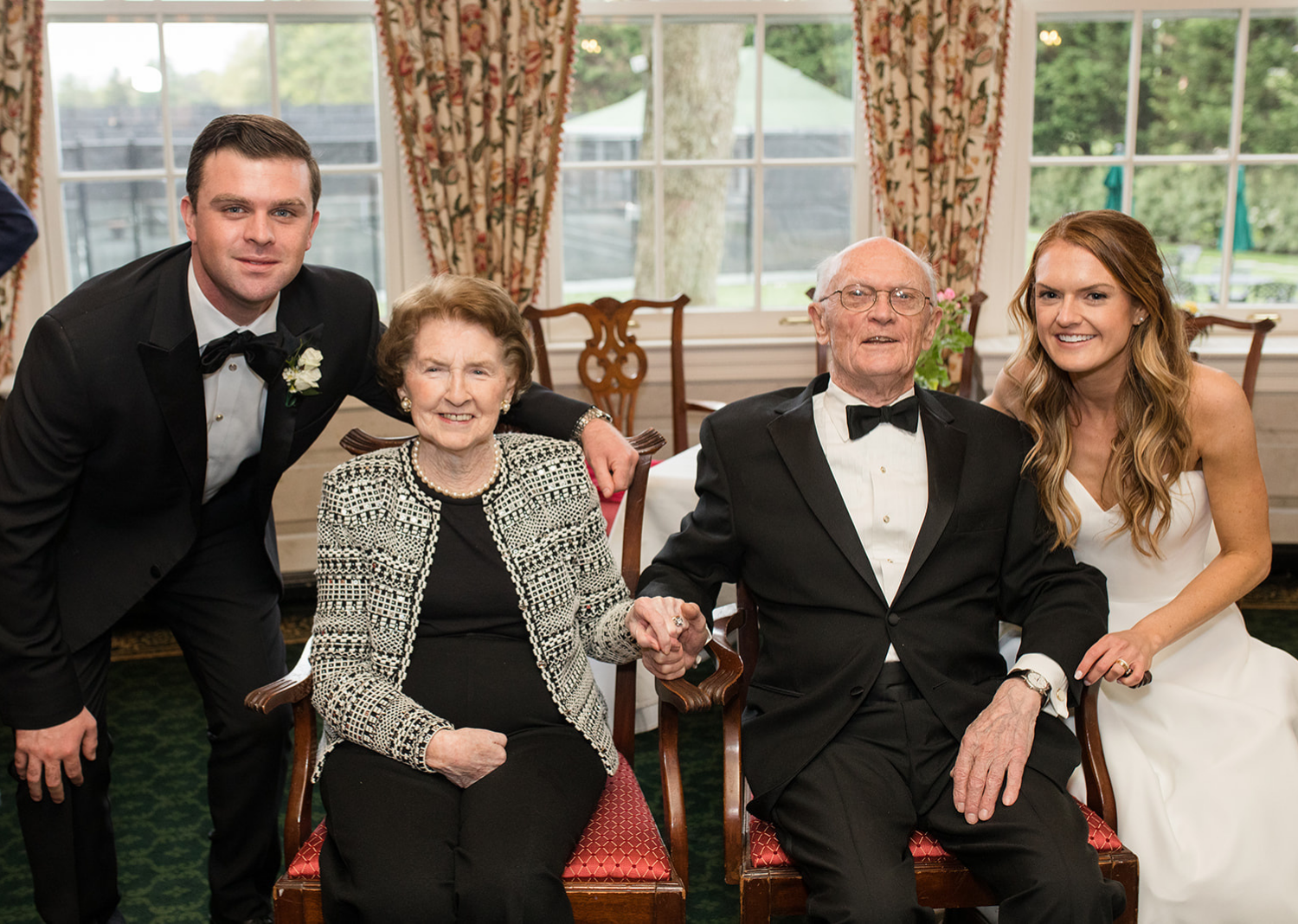 bride and groom with their parents 