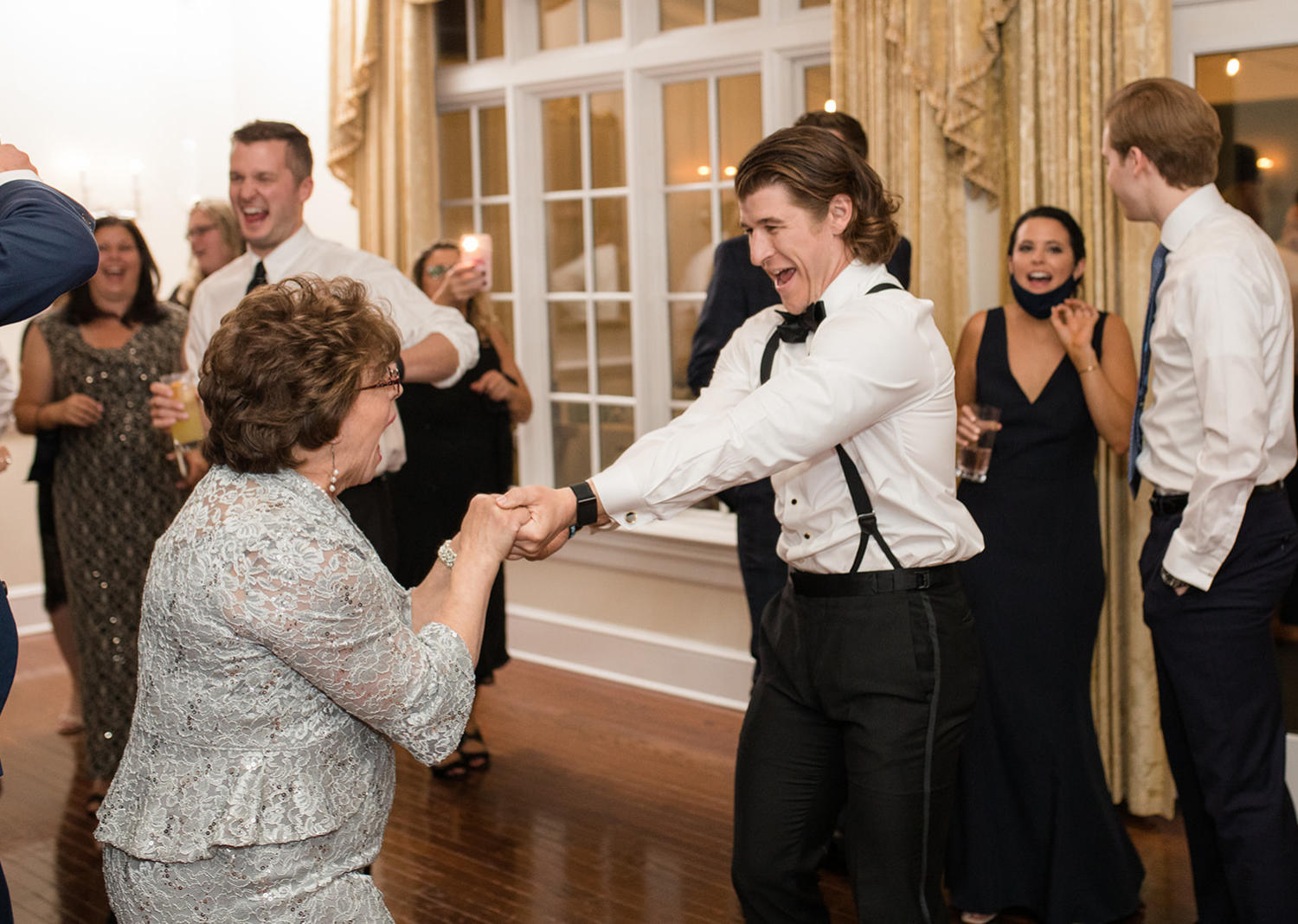 wedding day guests dancing during the wedding reception