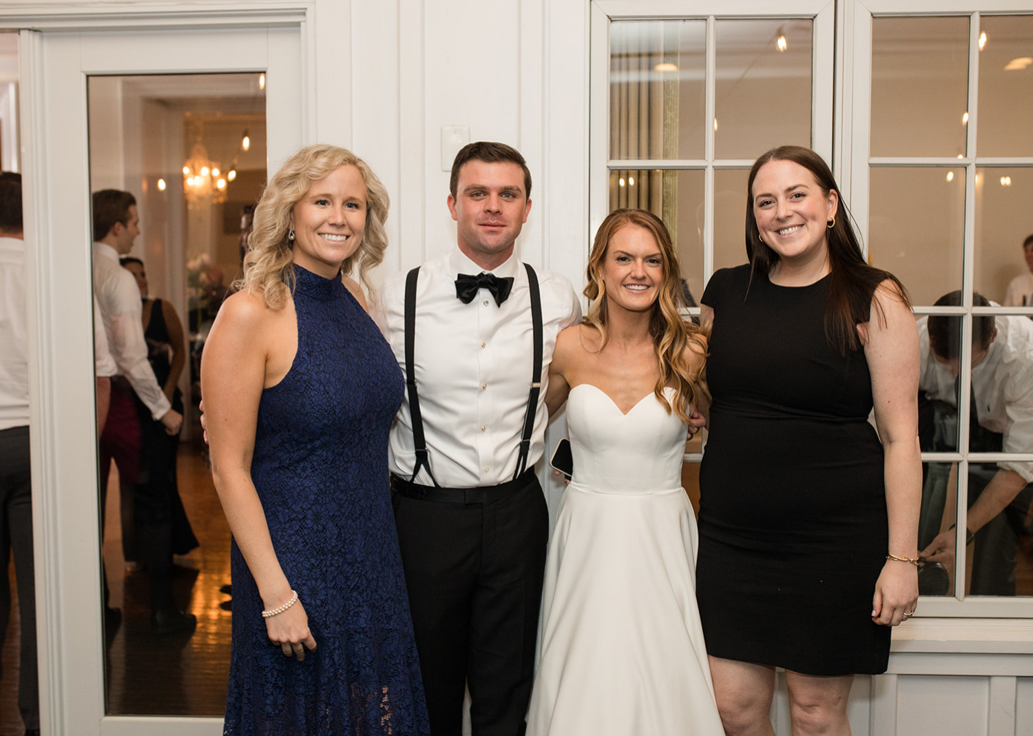 bride and groom with wedding guests 