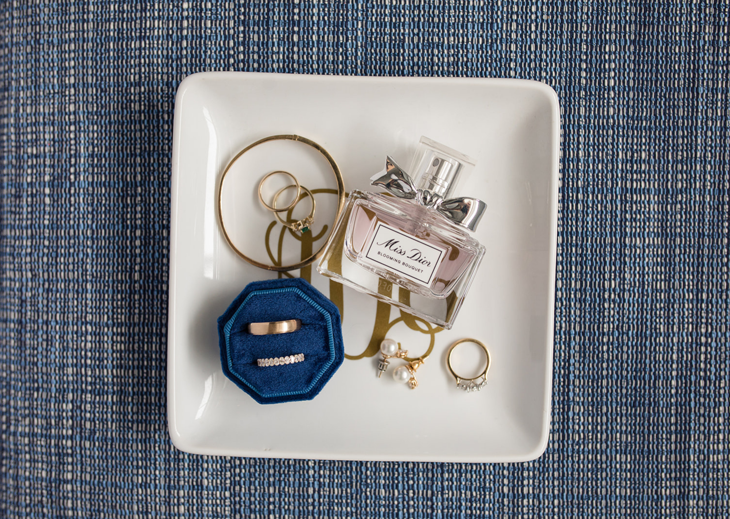 wedding rings and wedding accessories on a flat lay