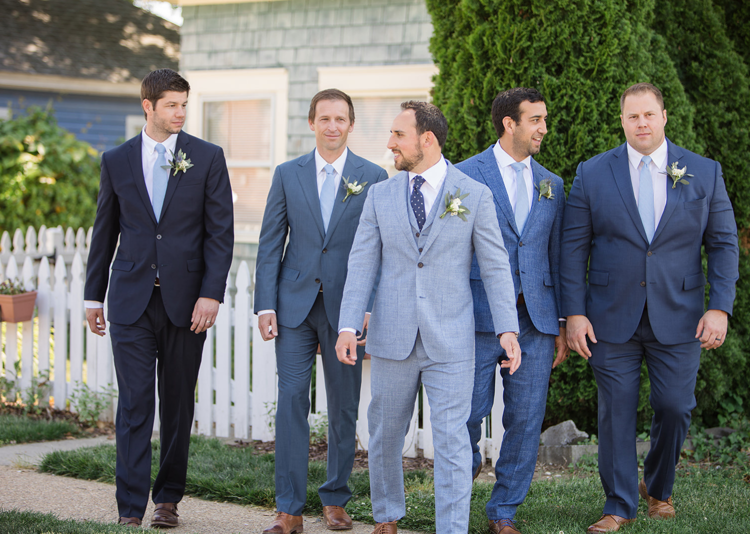 groom and groomsmen walking outside