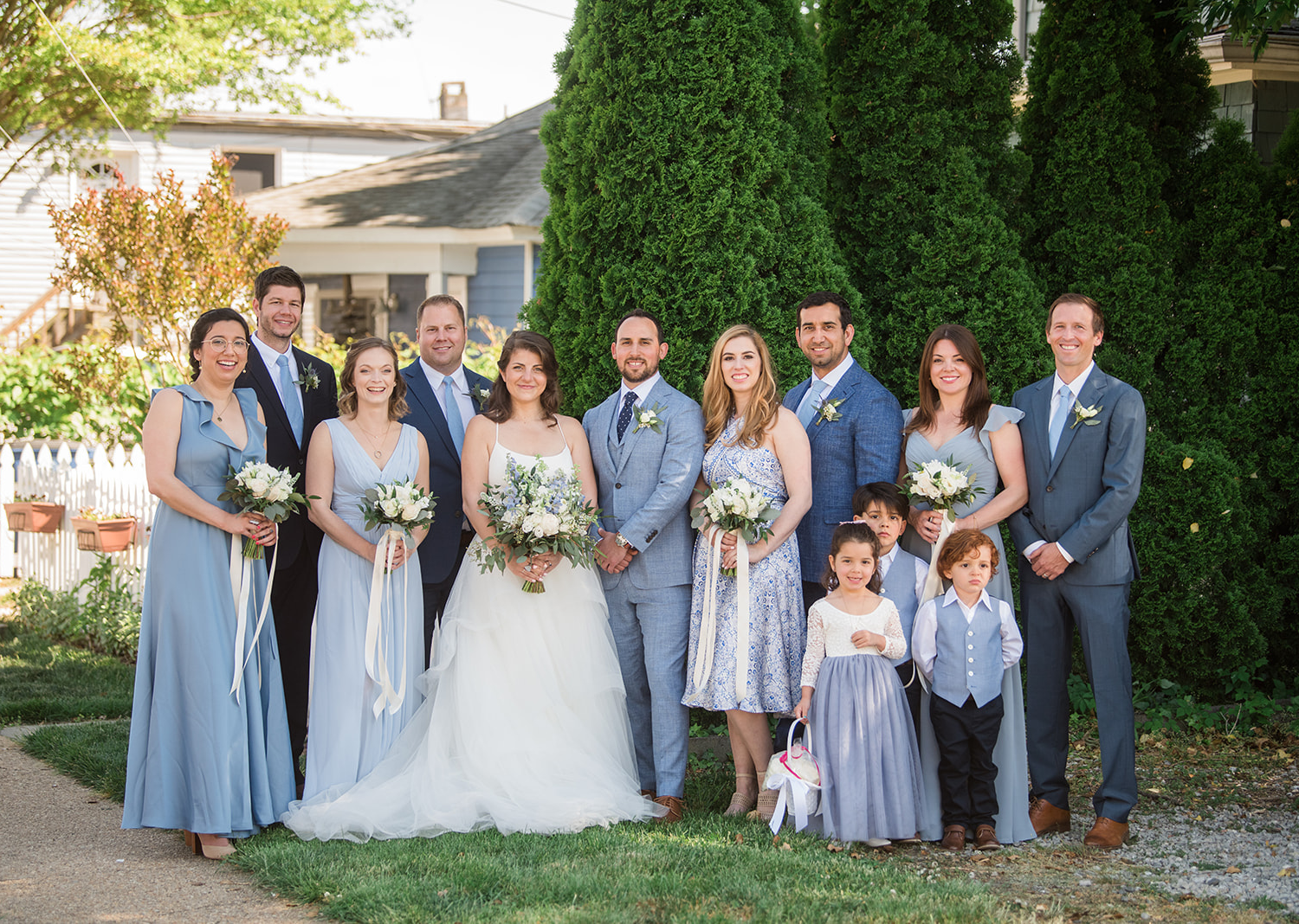 bride and groom with their wedding party