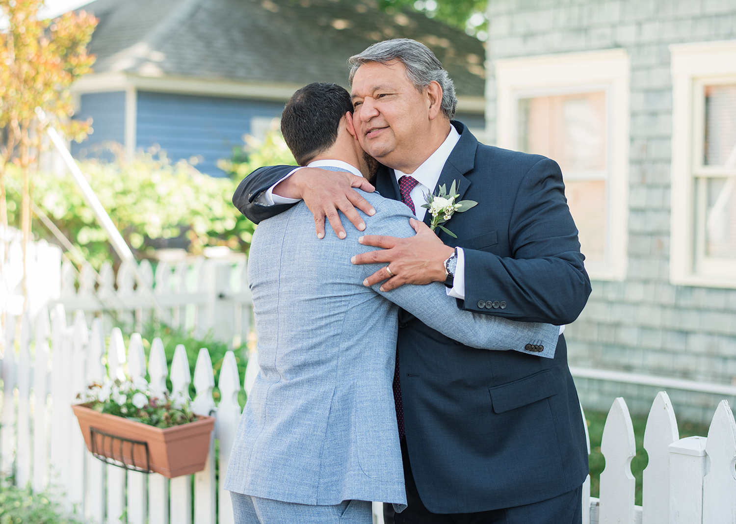 groom hugging his father on his wedding day