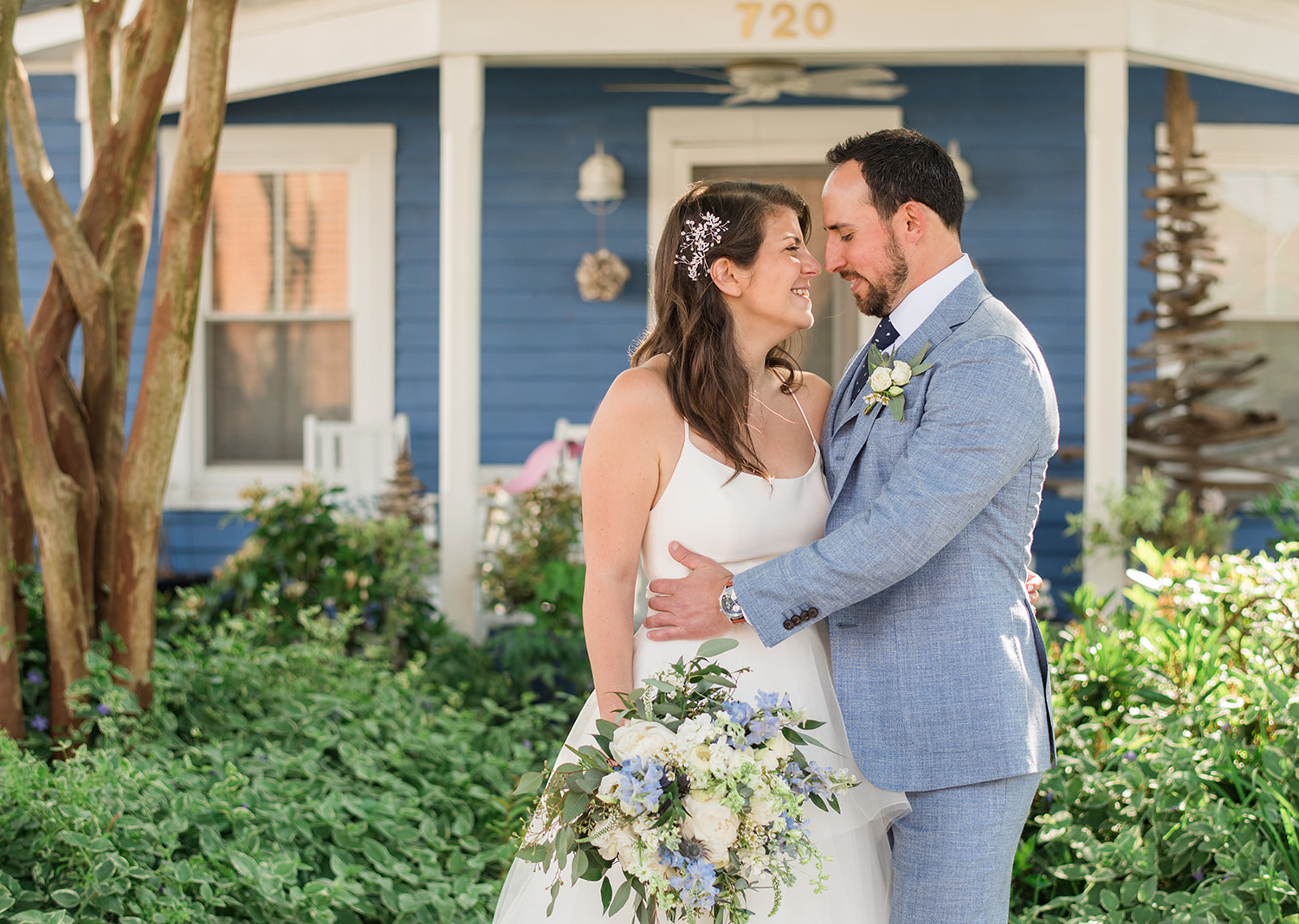 bride and groom romantically look at eachother 