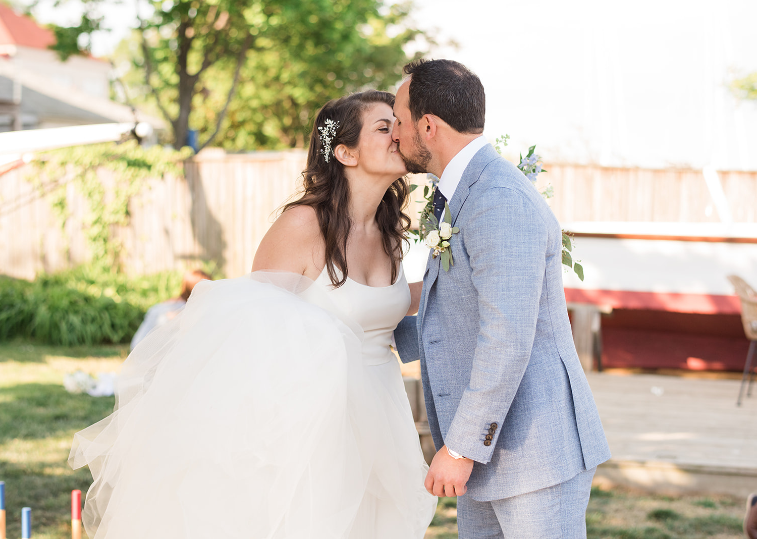 bride and groom share a kiss