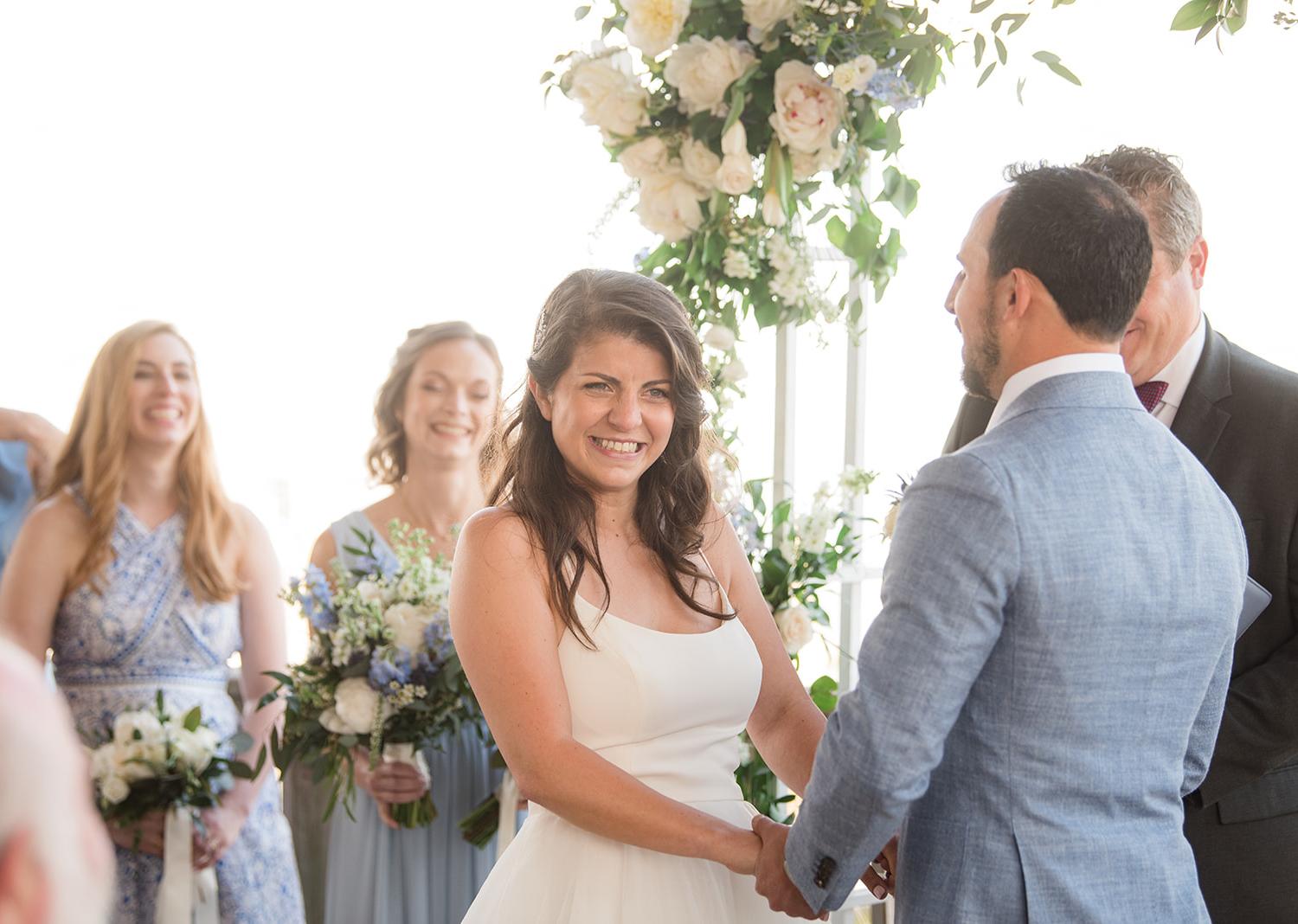 bride smiling as the ceremony begins