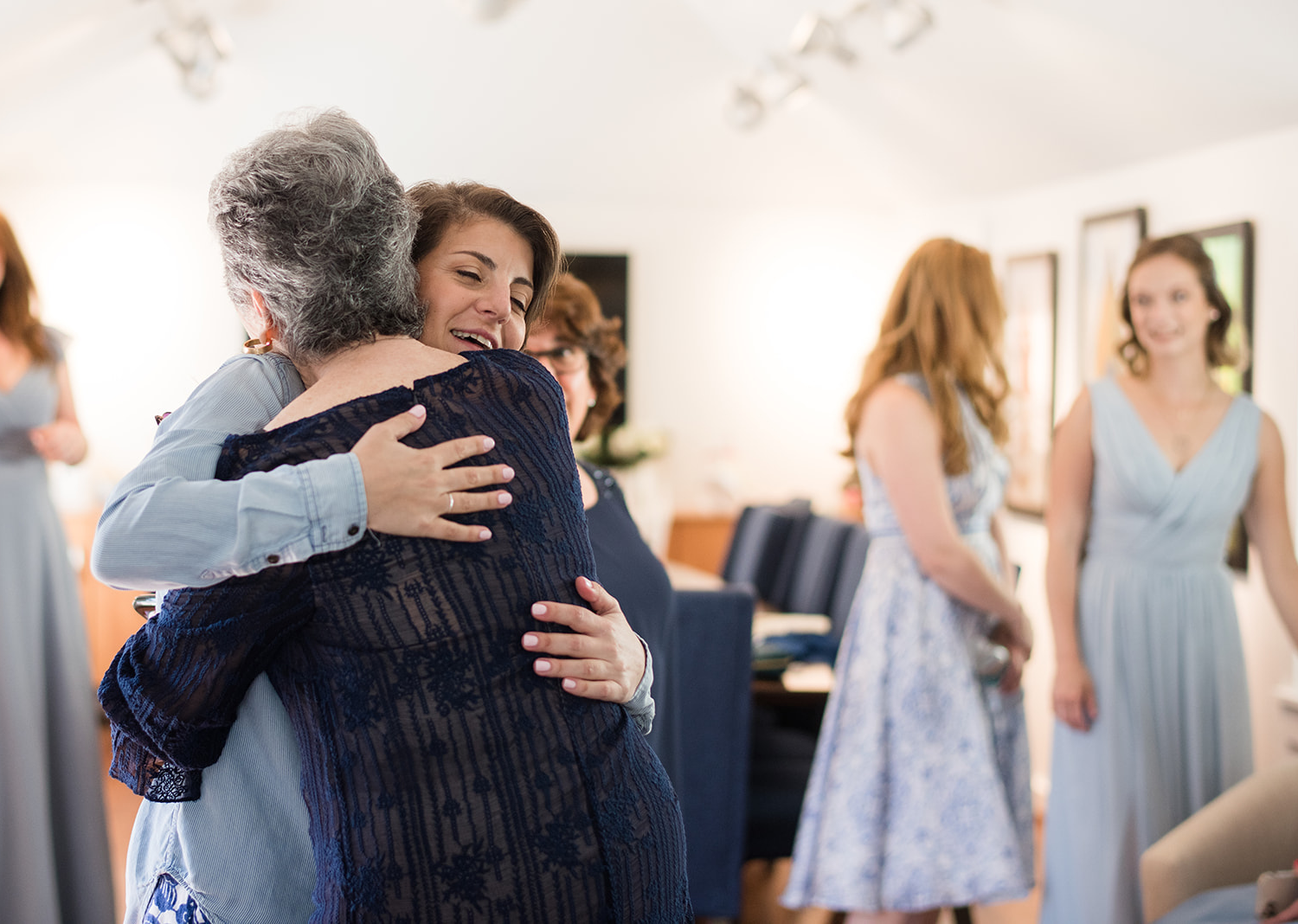 bride hugging her grandma as they get ready