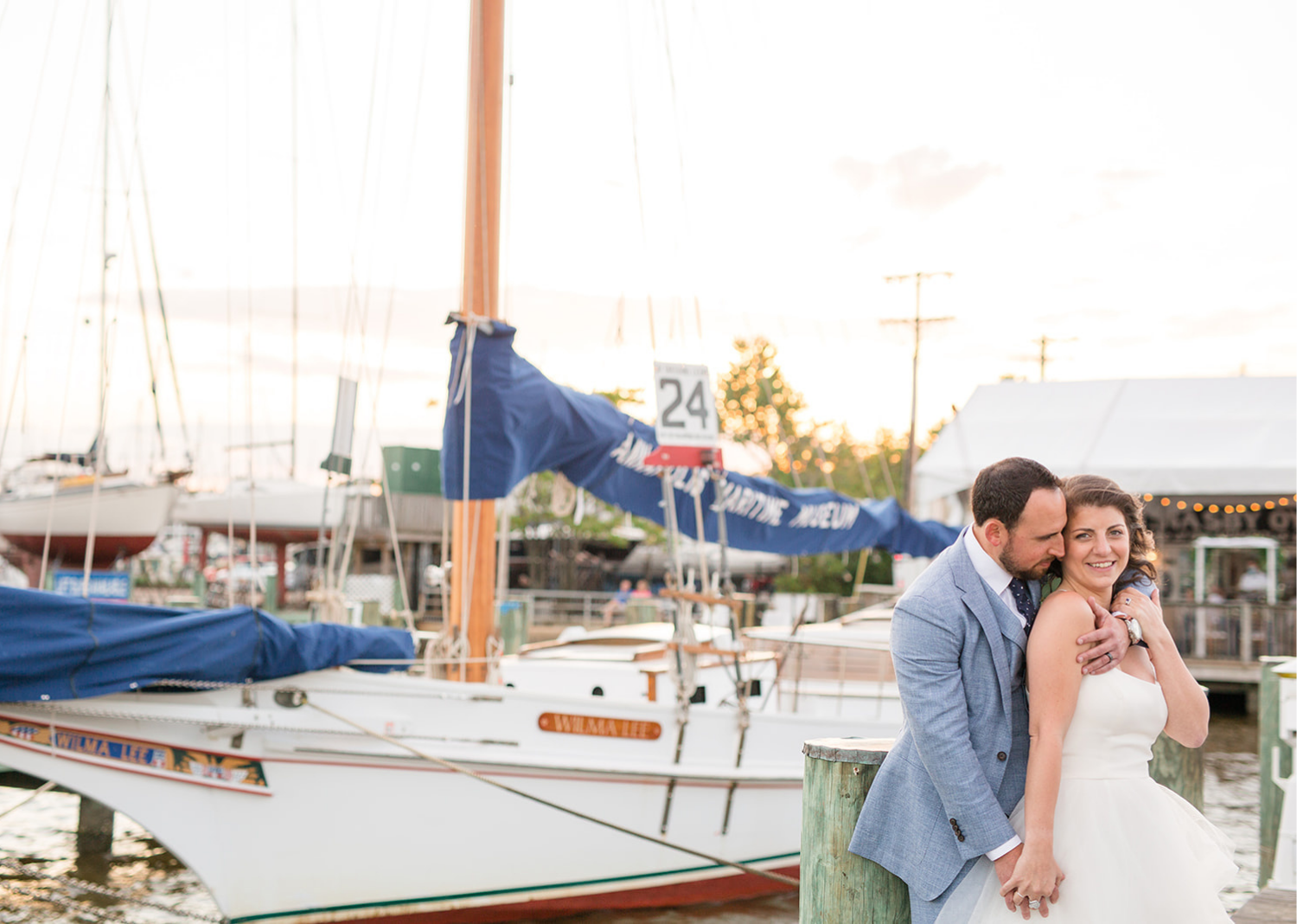 the groom hugs his bride