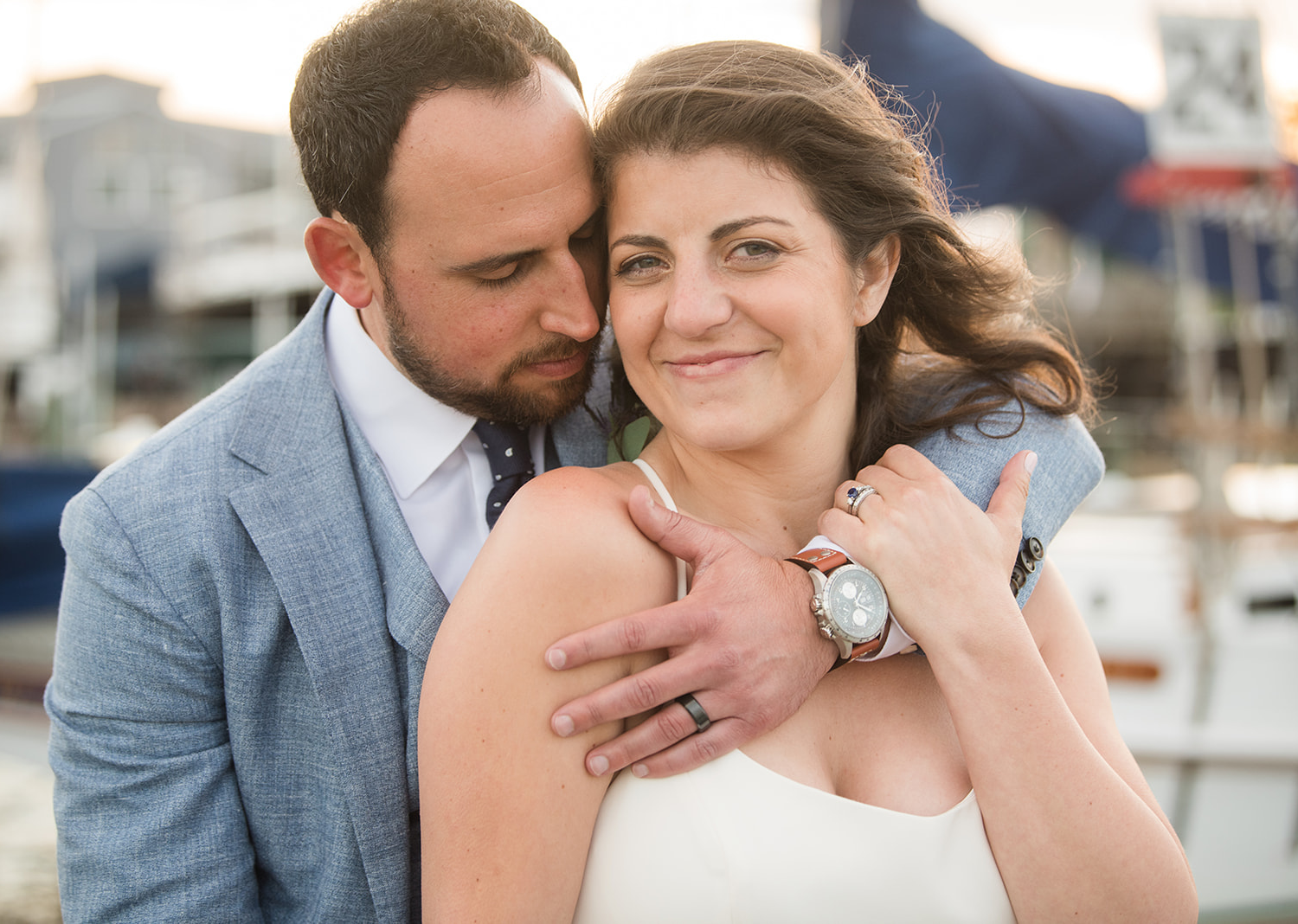 groom hugging his wife 