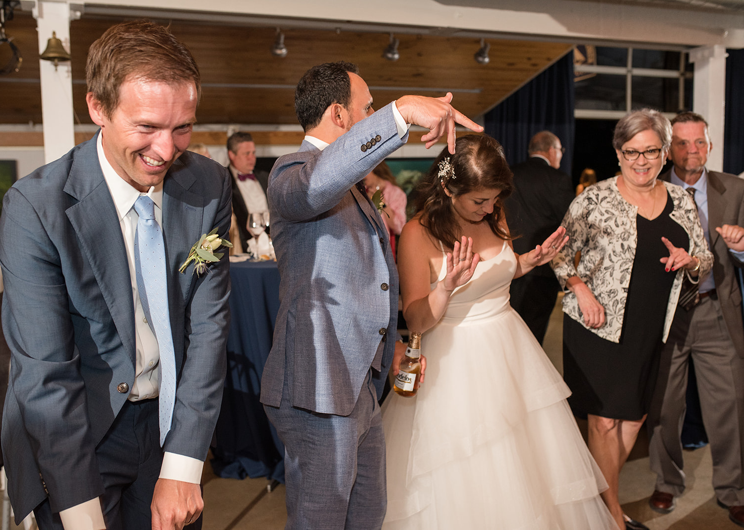 bride and groom dancing with their wedding guests