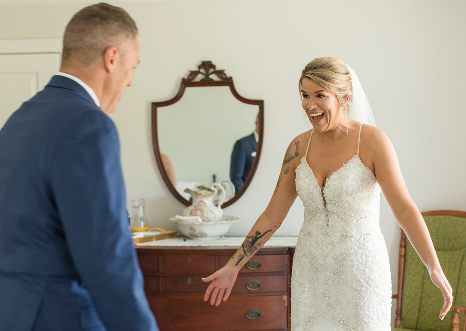 father of the bride sees his daughter in a wedding dress for the first time