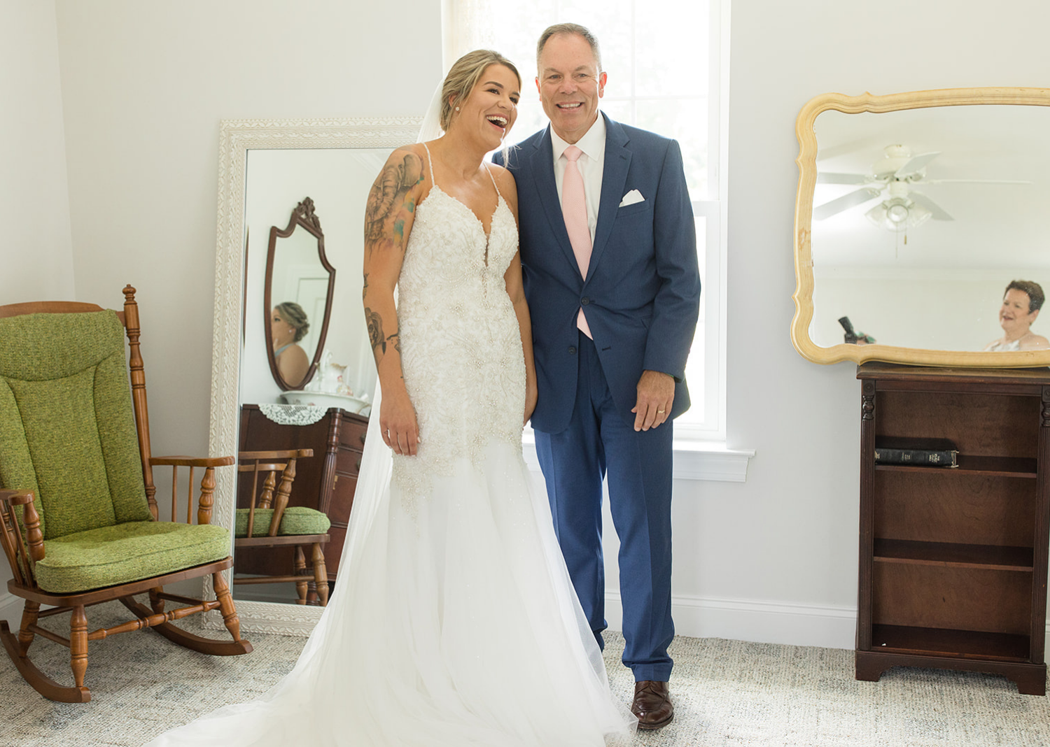 father of the bride and the bride smiling