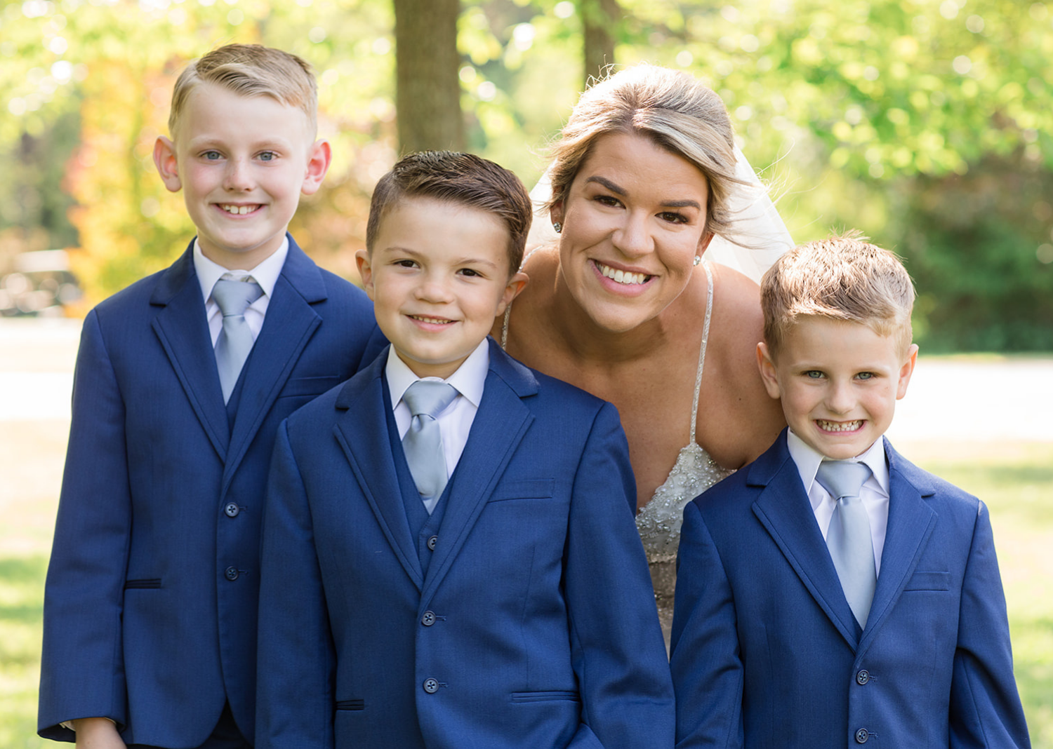 bride with her sons before the wedding ceremony