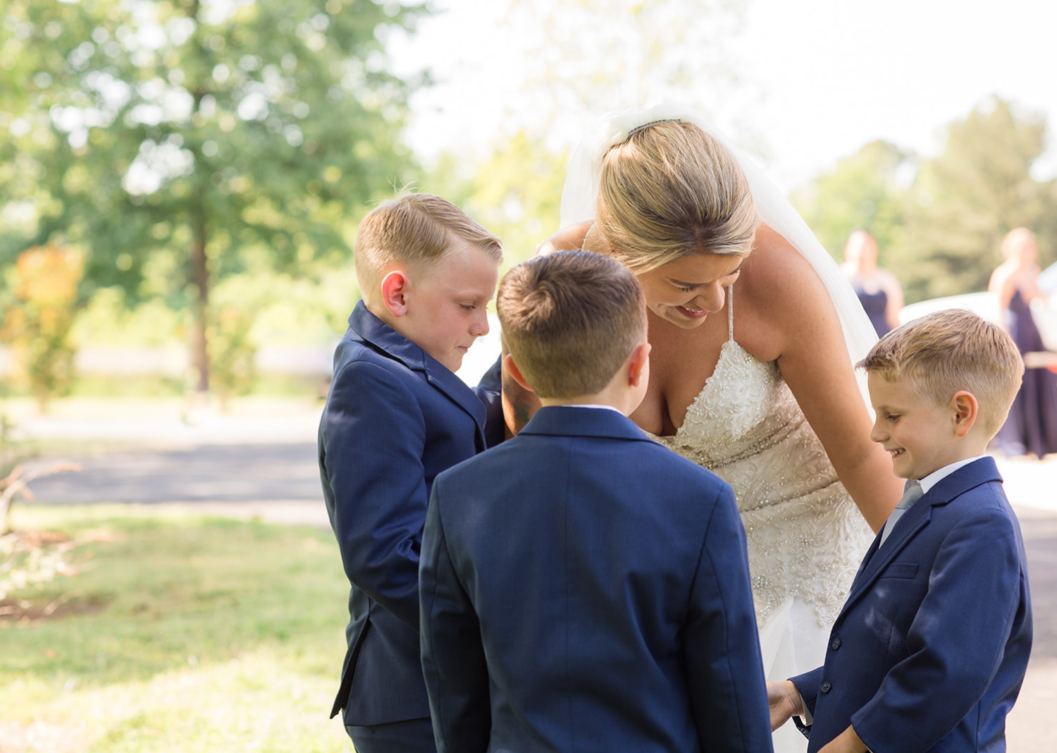 bride with her sons before wedding ceremony