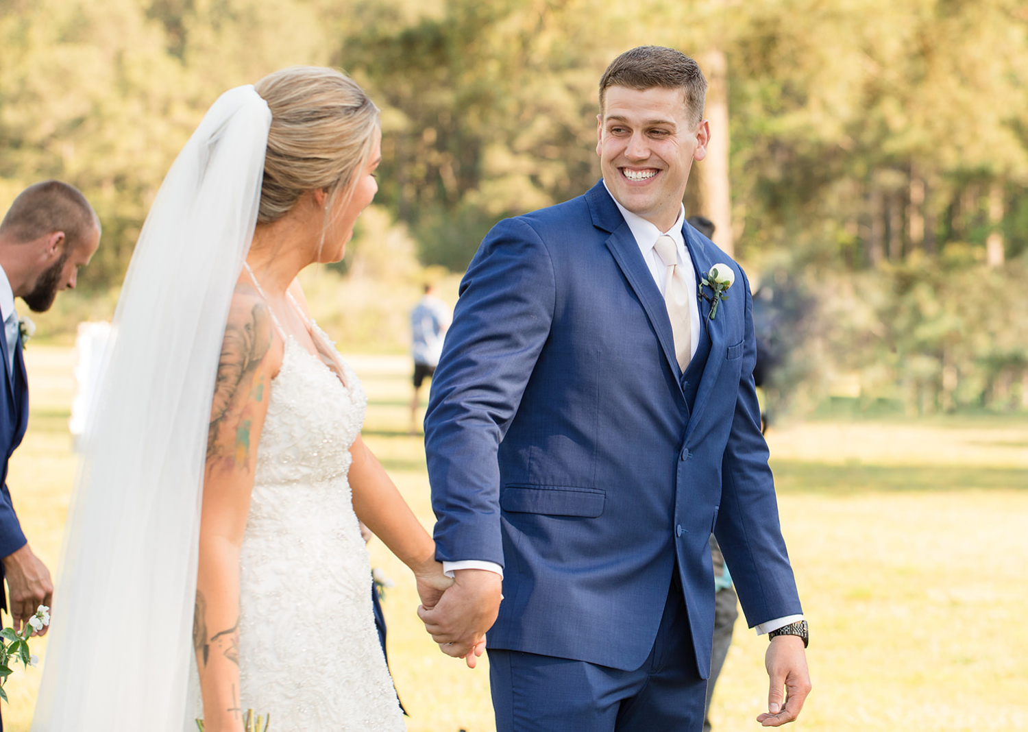 bride and groom walking down the asile