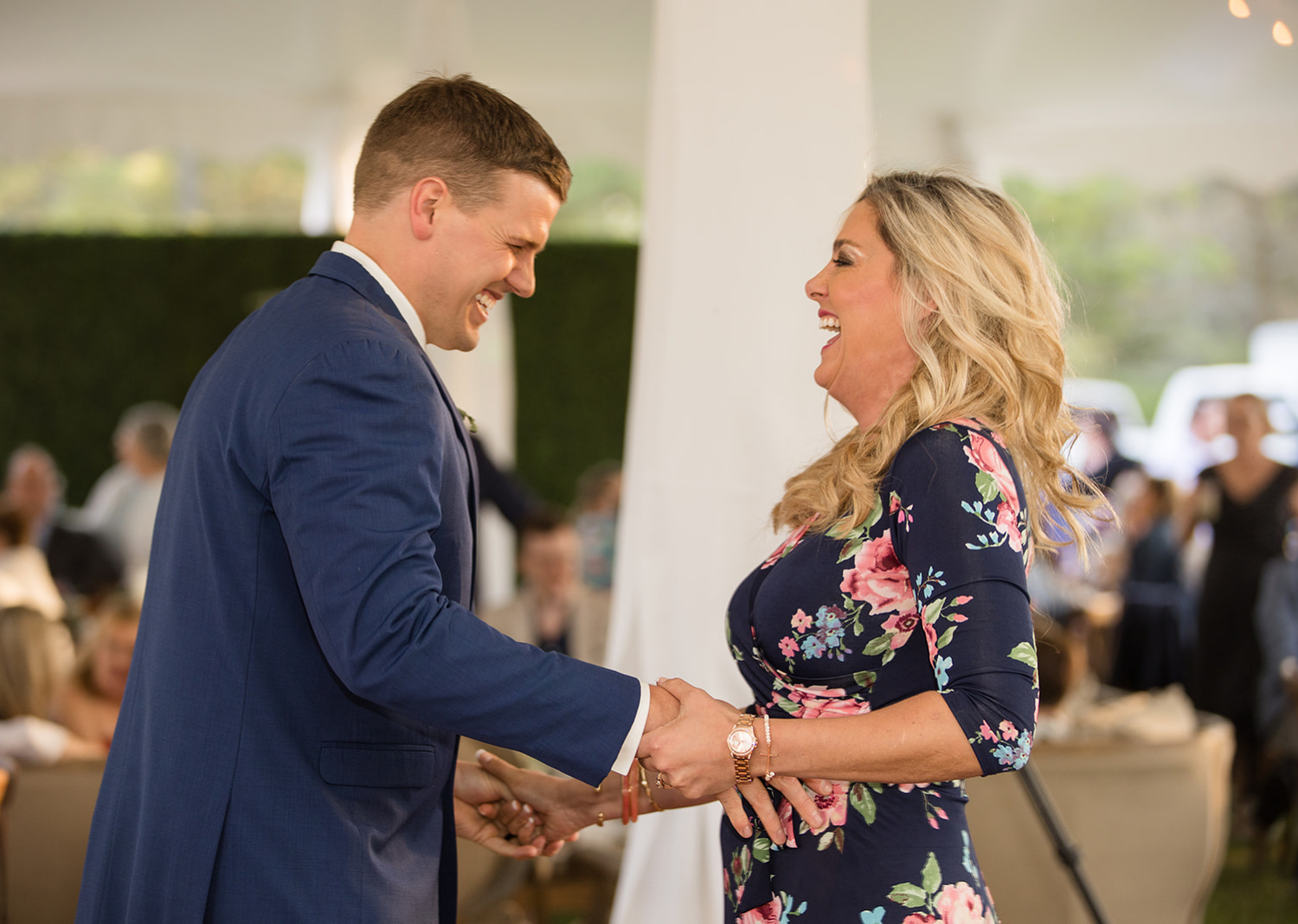 groom dancing with his family members 