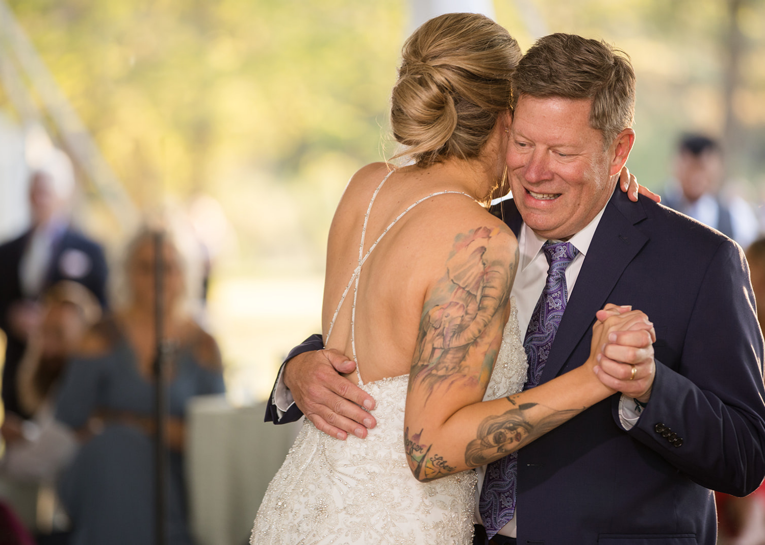 bride dancing with her family members 