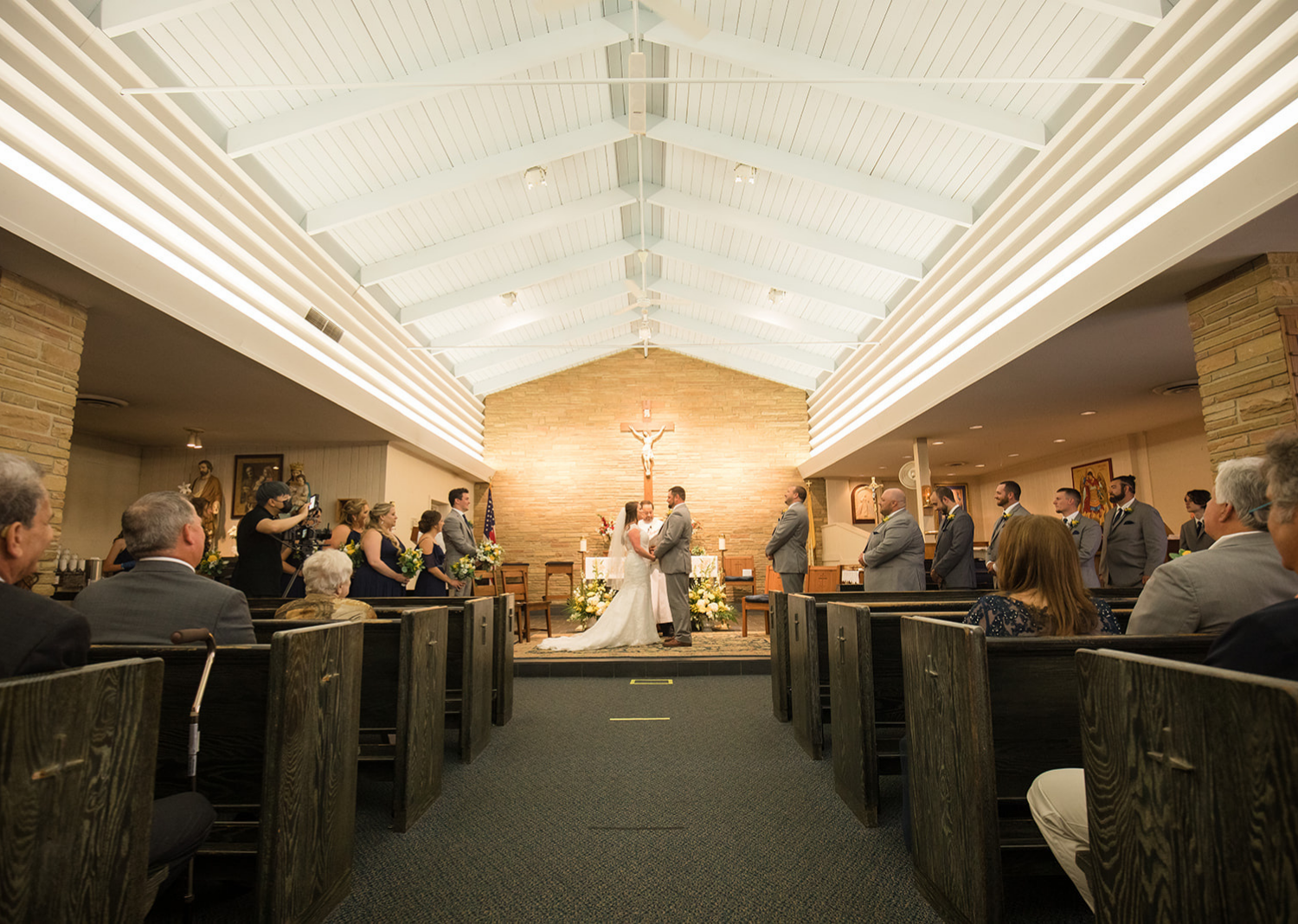 bride and groom holding hands during their ceremony