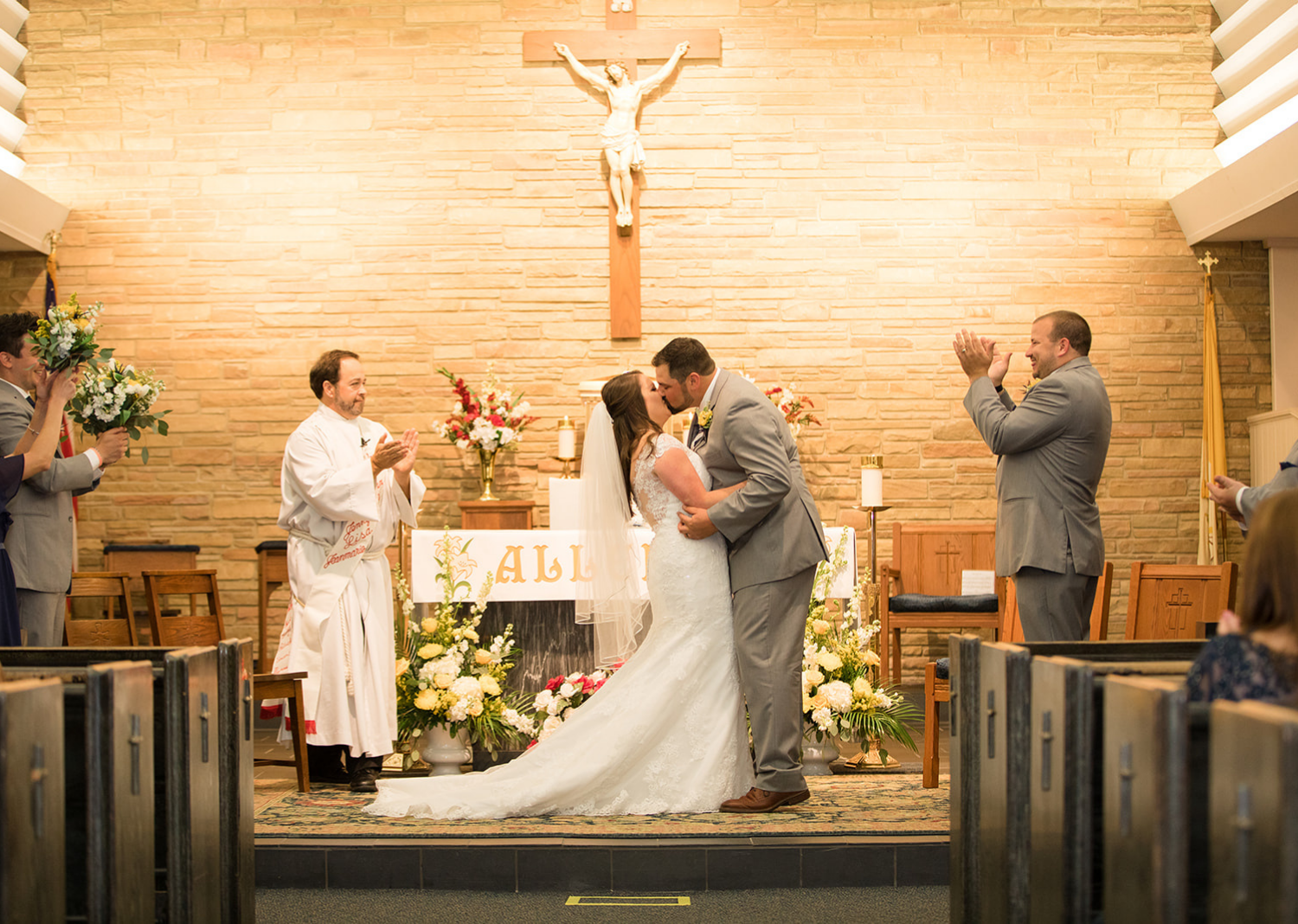 bride and groom share their first kiss as husband and wife