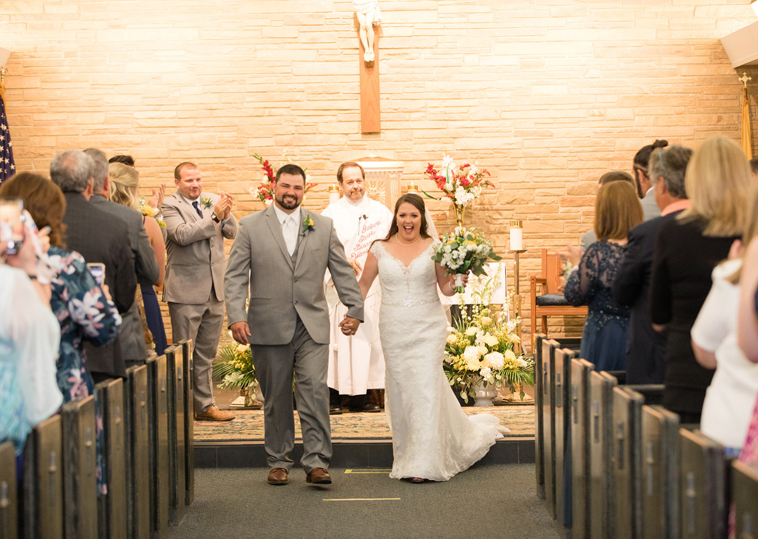 bride and groom walking down the aisle