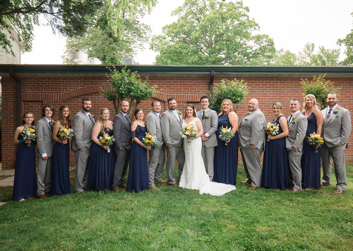 bride and groom with their wedding party