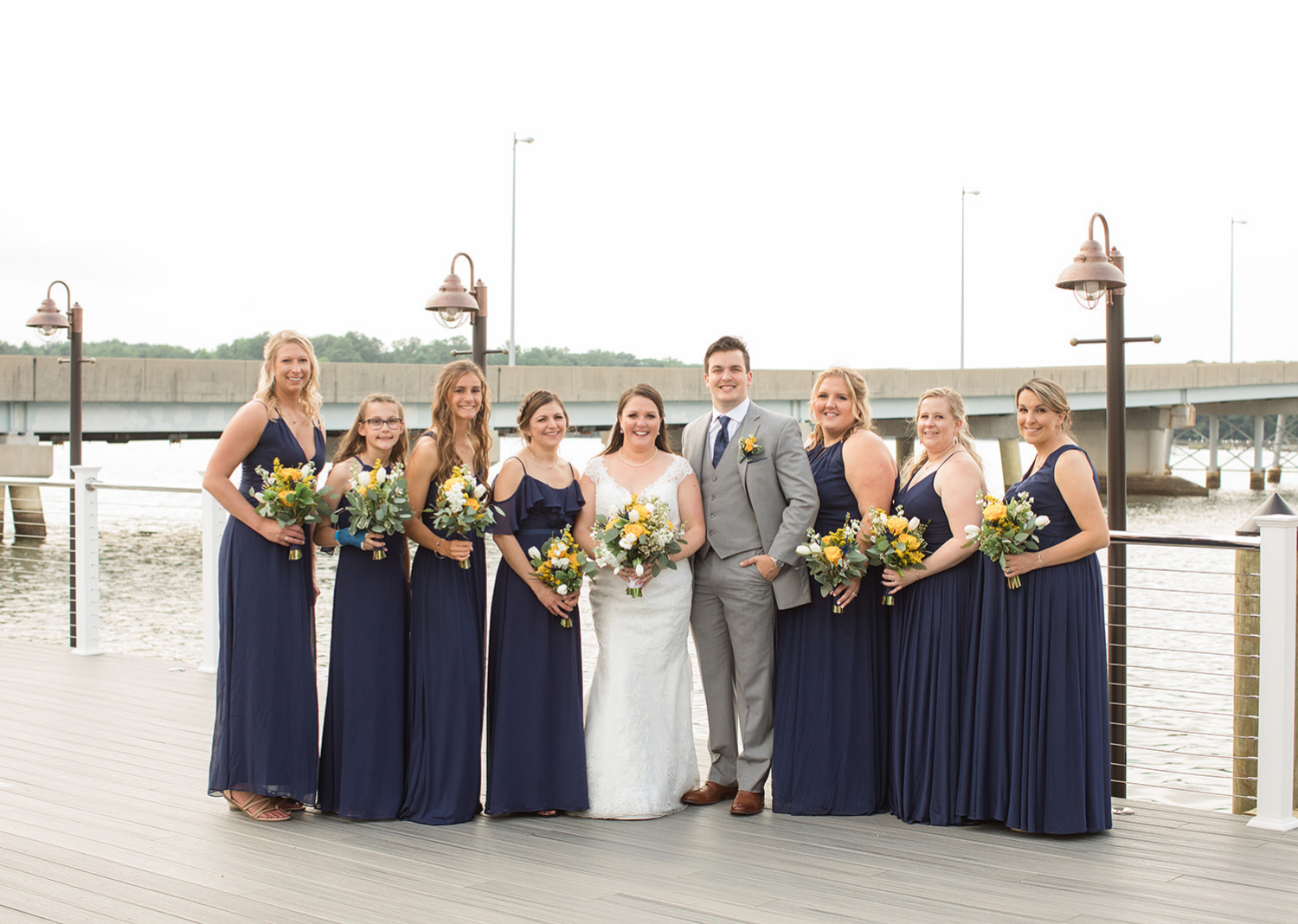 bride and groom with their wedding party