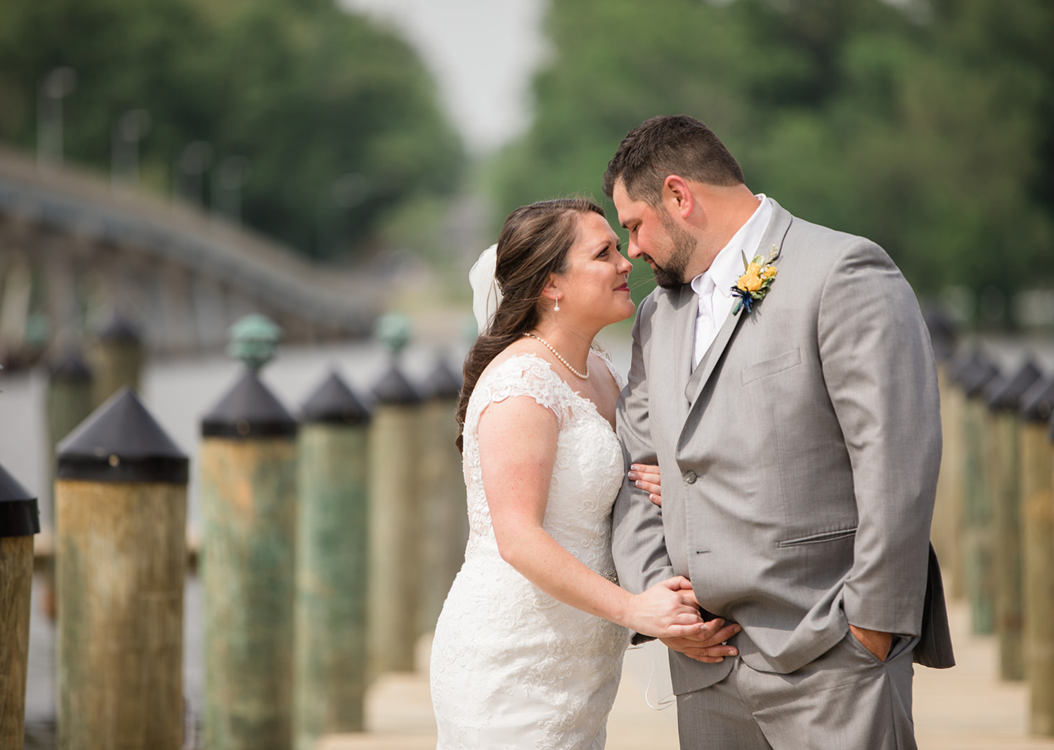 bride and groom outdoor portraits on the pier