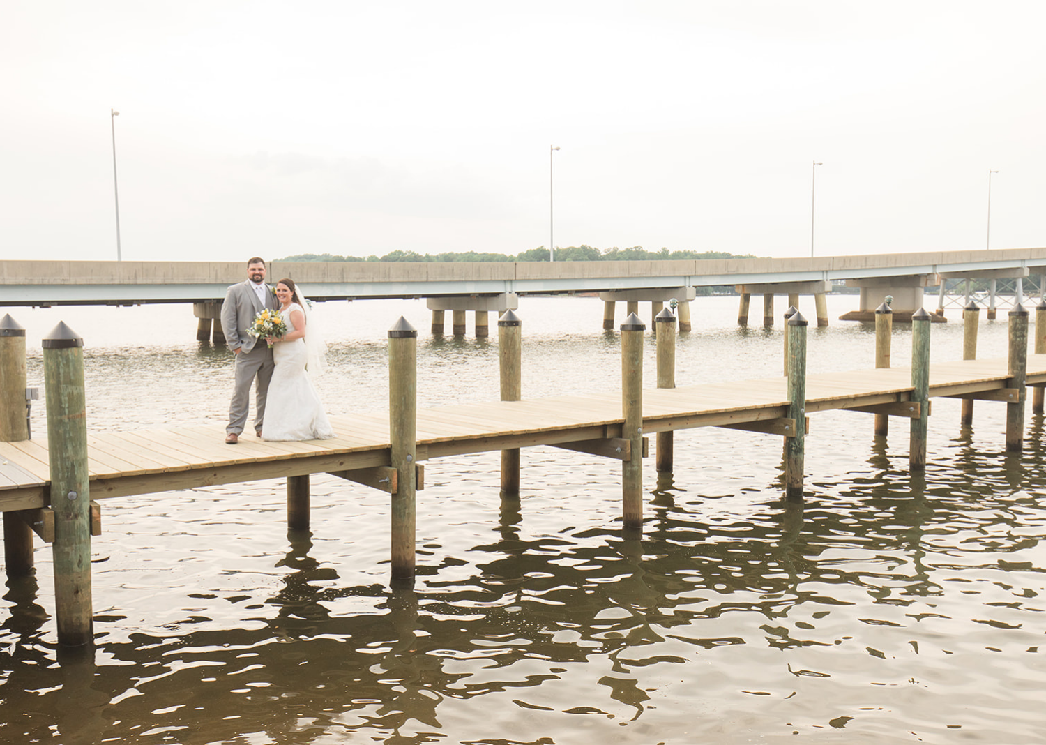 bride and groom outdoor portraits on the pier 