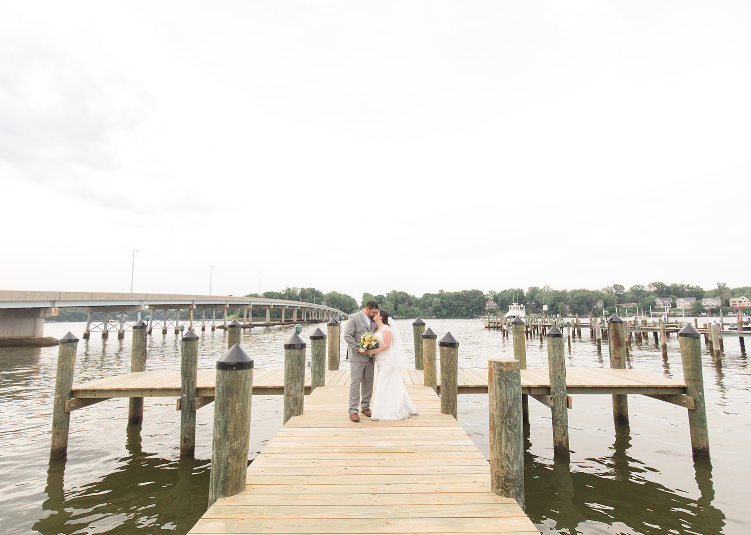 bride and groom outdoor portraits on the pier 