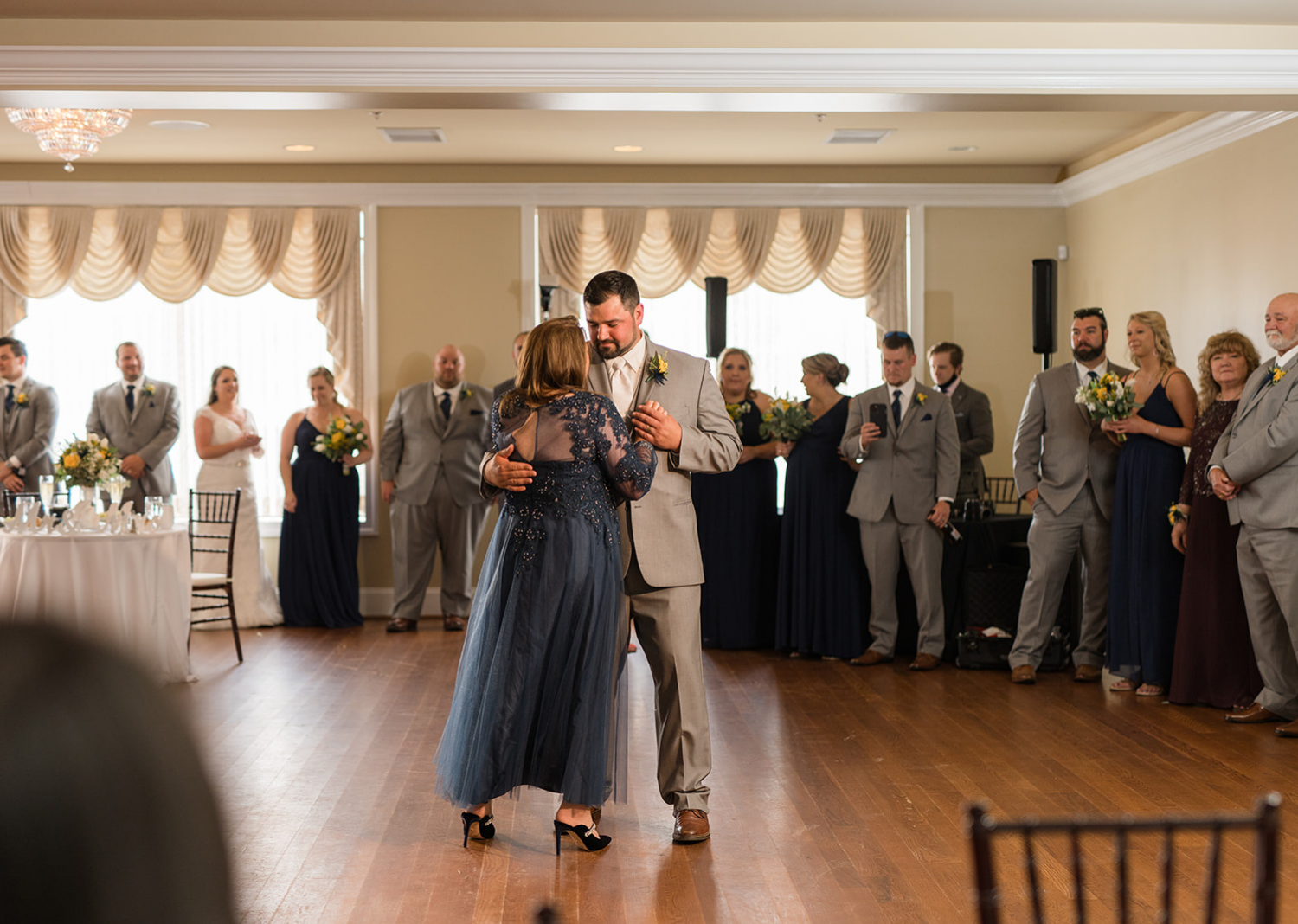 groom and mother of the groom dancing