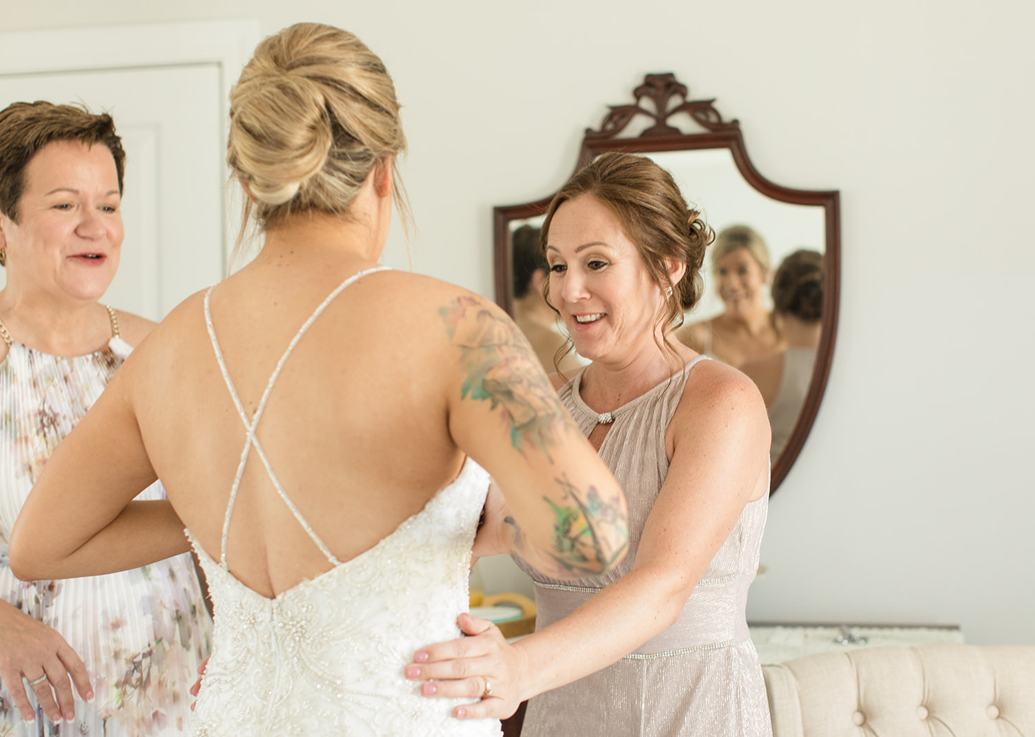 bride getting ready with the mother of the bride